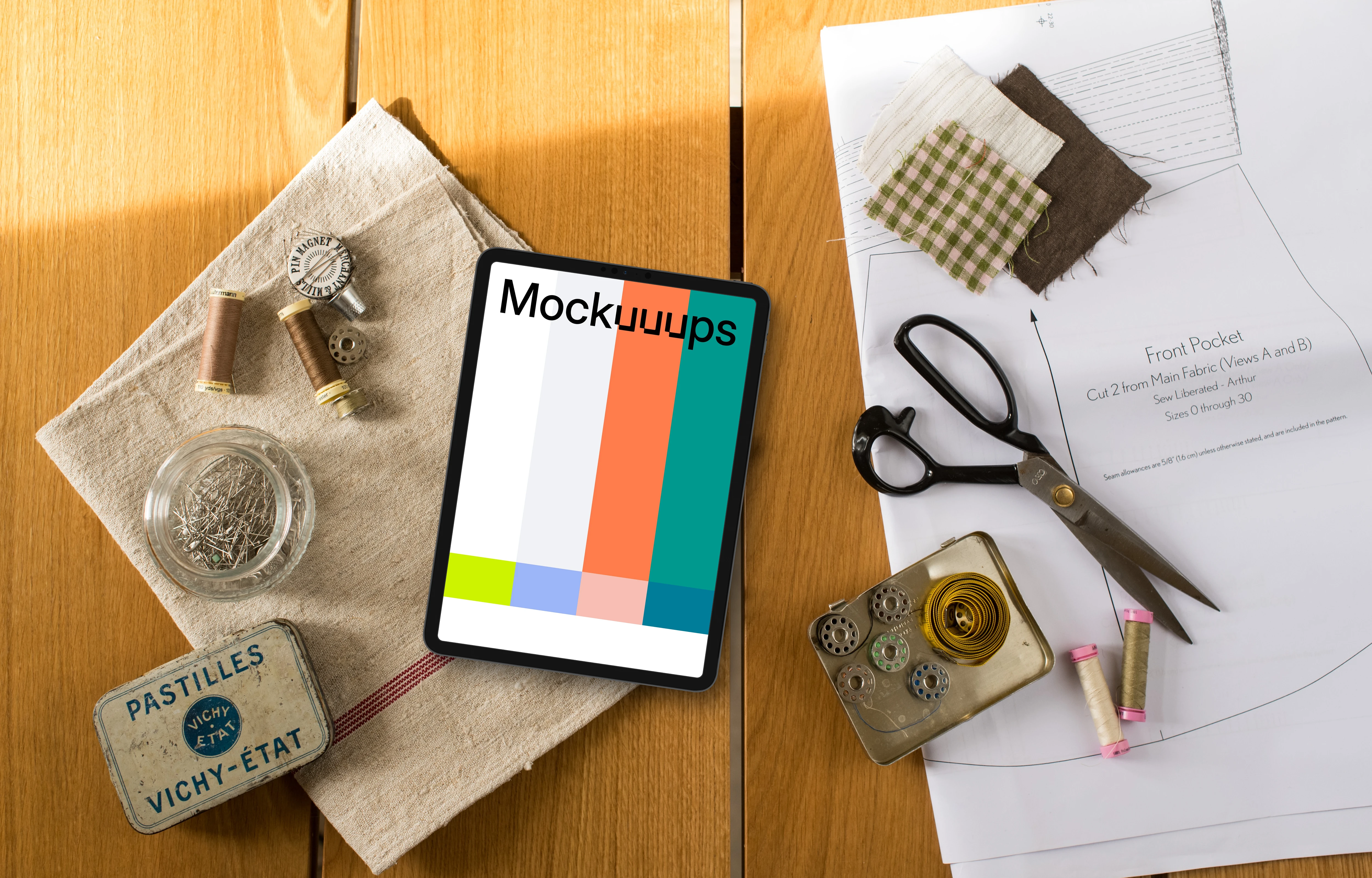 Top view of tablet mockup with sewing table on the side