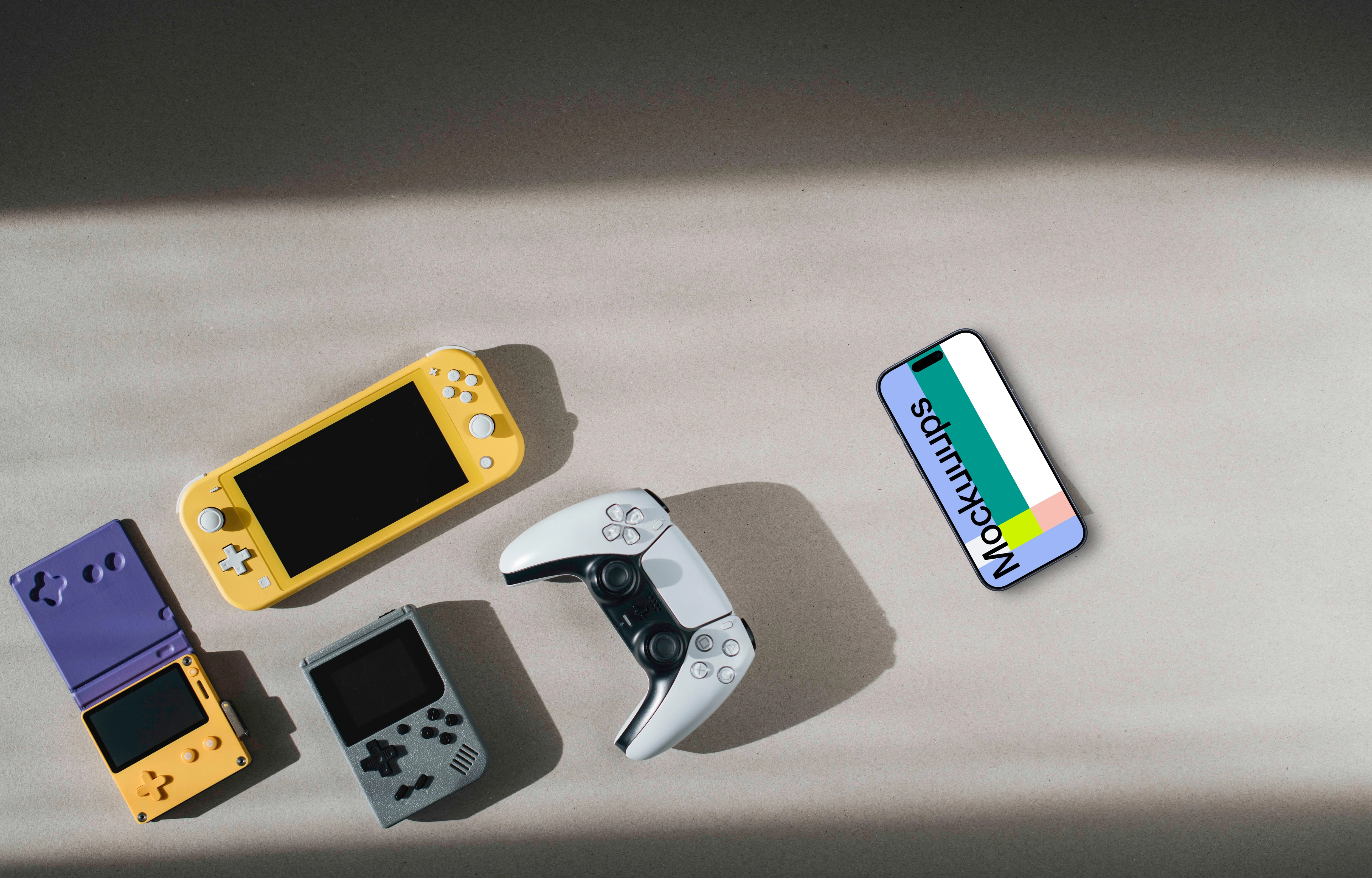Smartphone mockup among gaming devices on neutral background