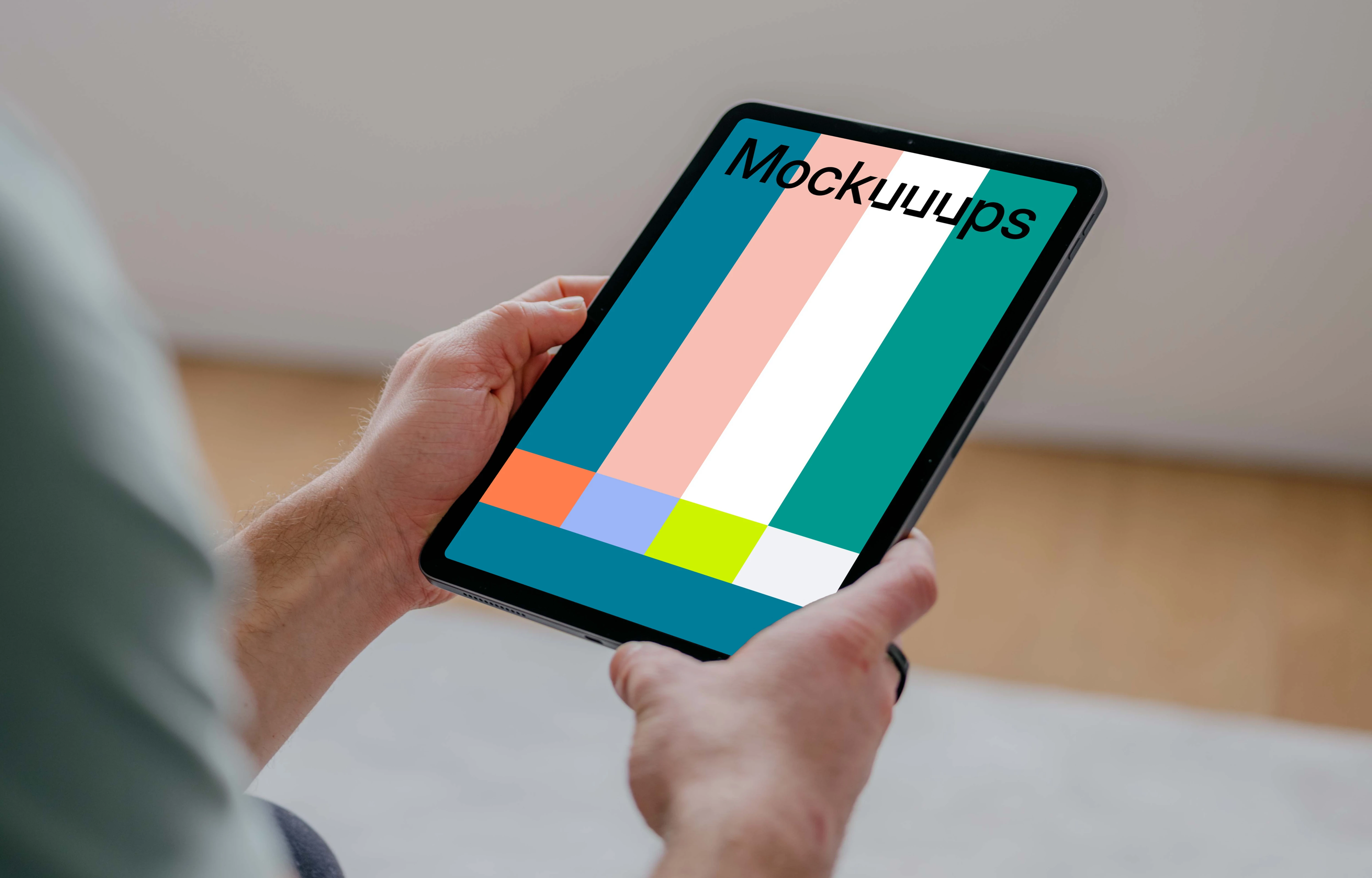 User holding an iPad Air mockup