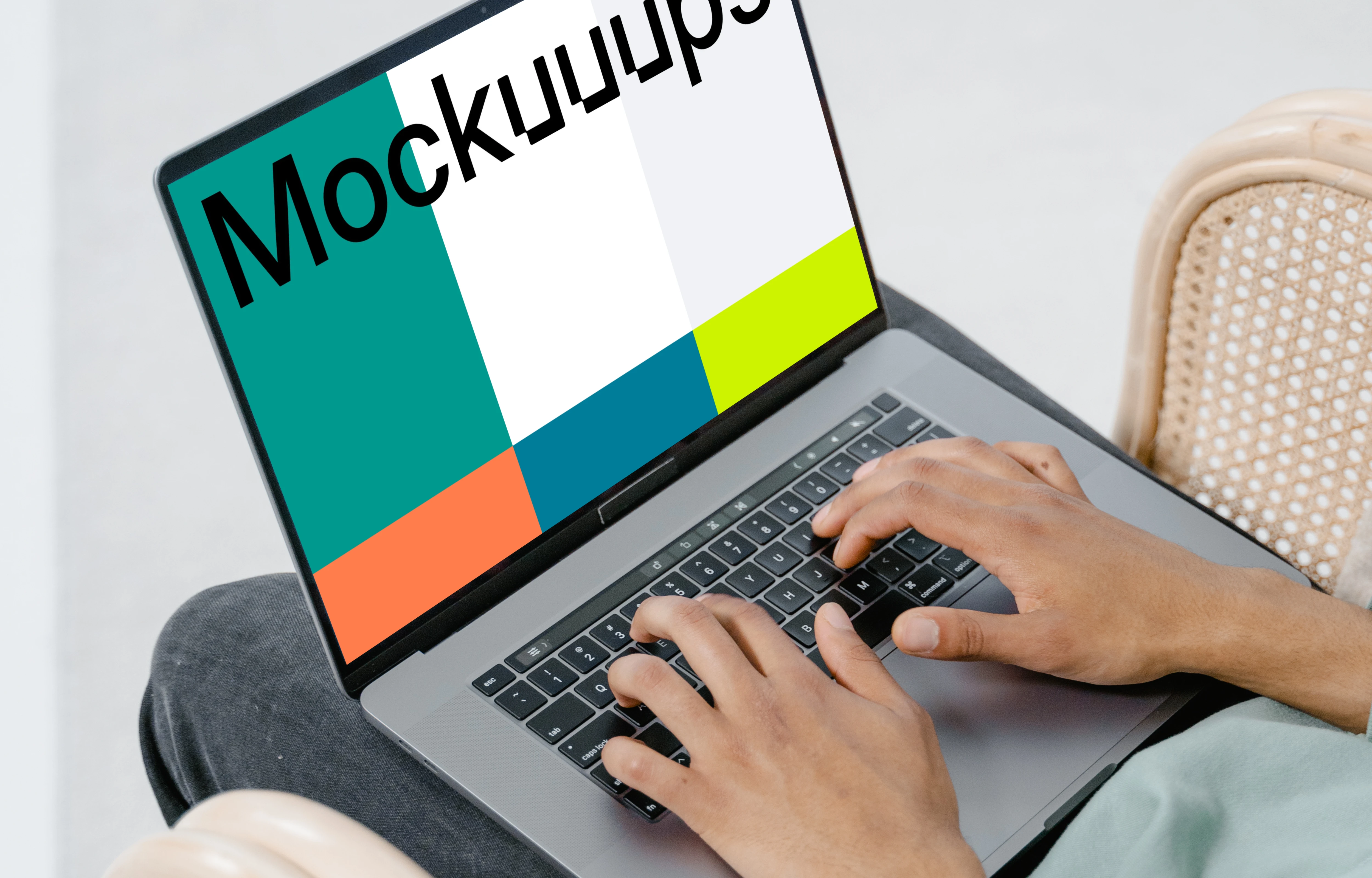 User typing on a MacBook mockup