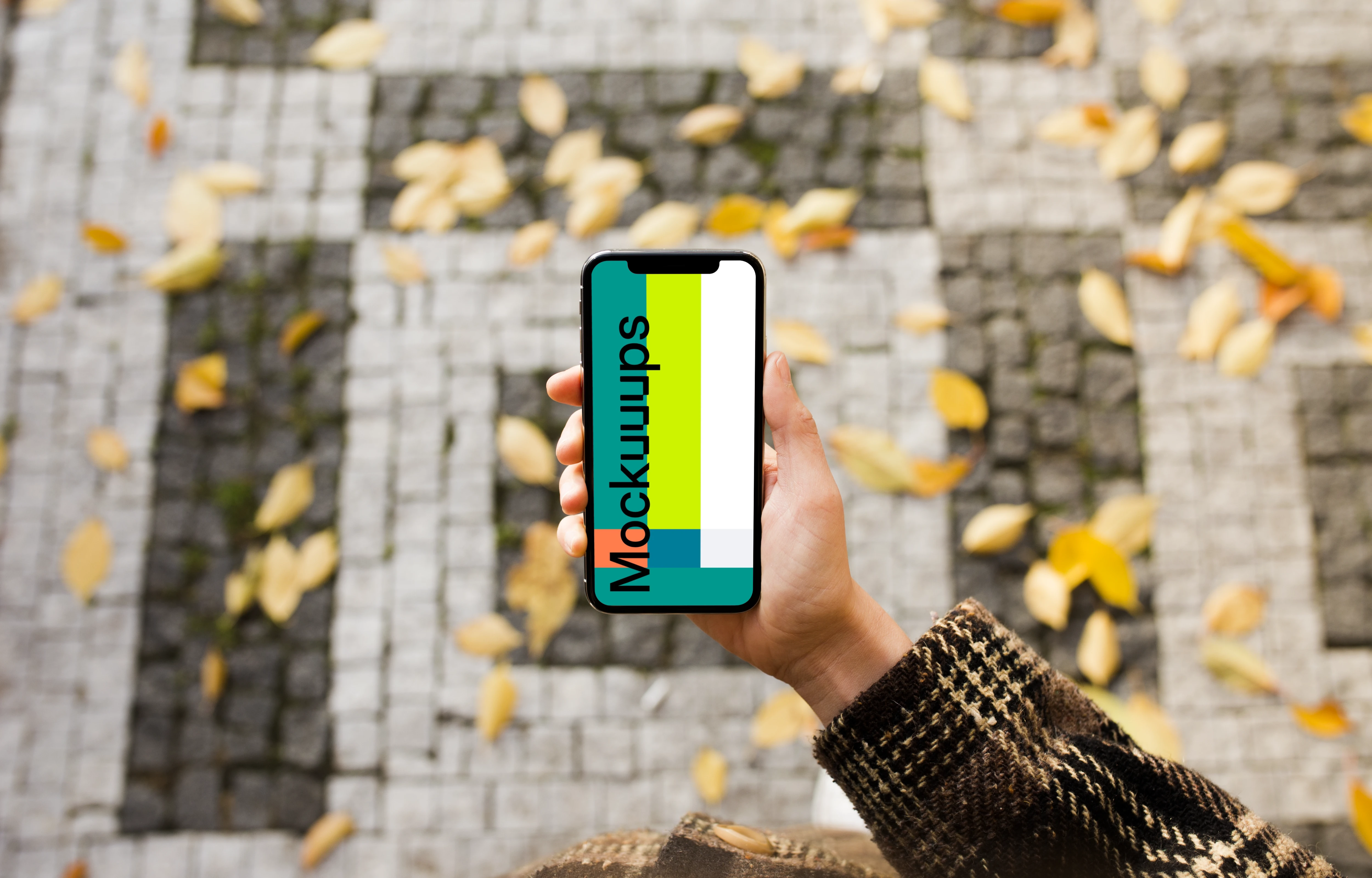 Woman standing with iPhone X mockup