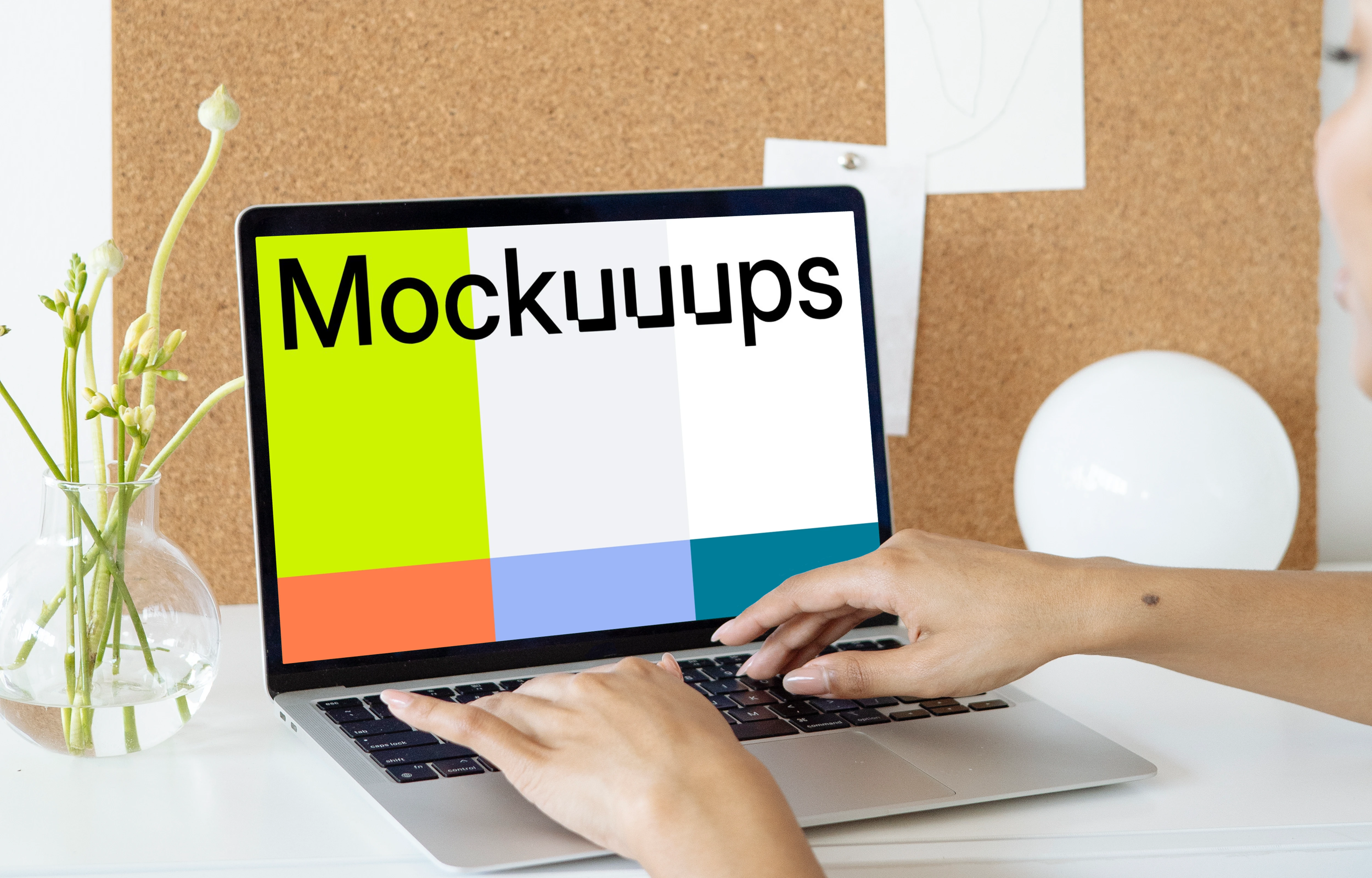 Woman using a MacBook Pro mockup in front of a bulletin board