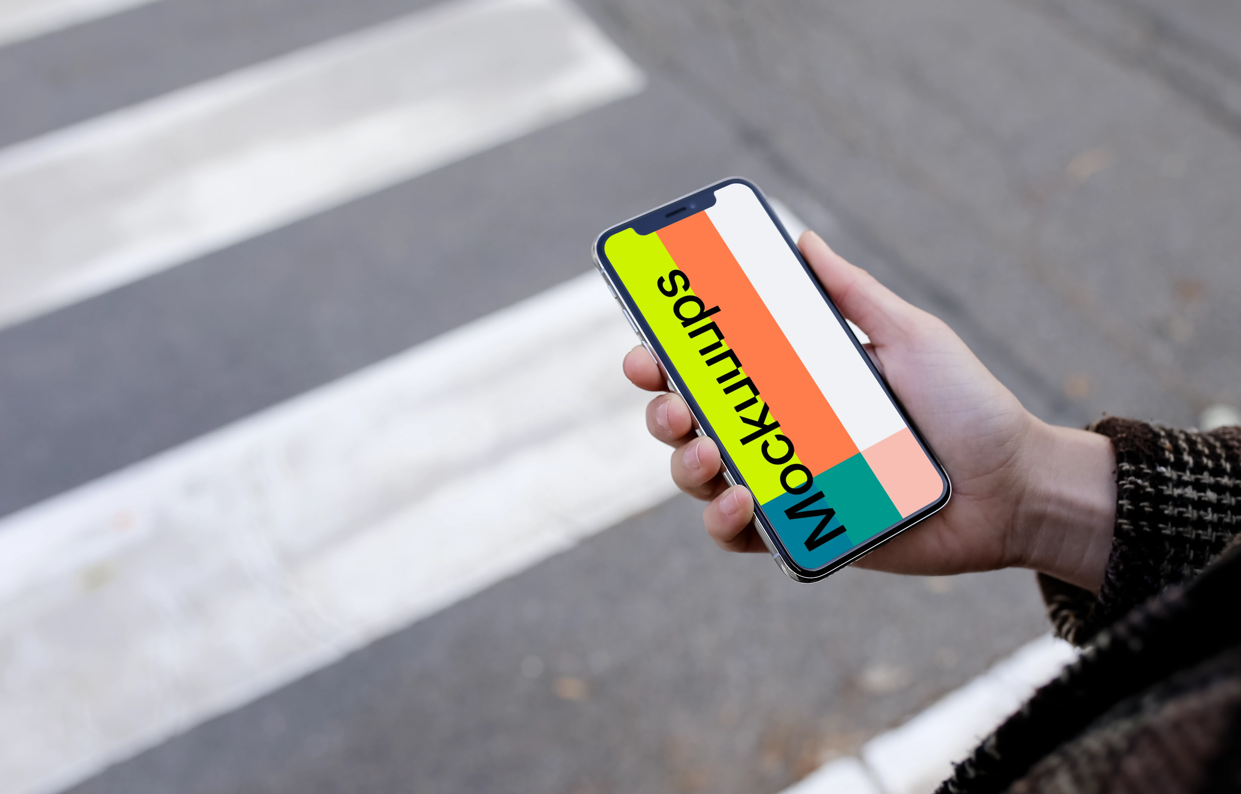 Woman walking down the street with iPhone X mockup
