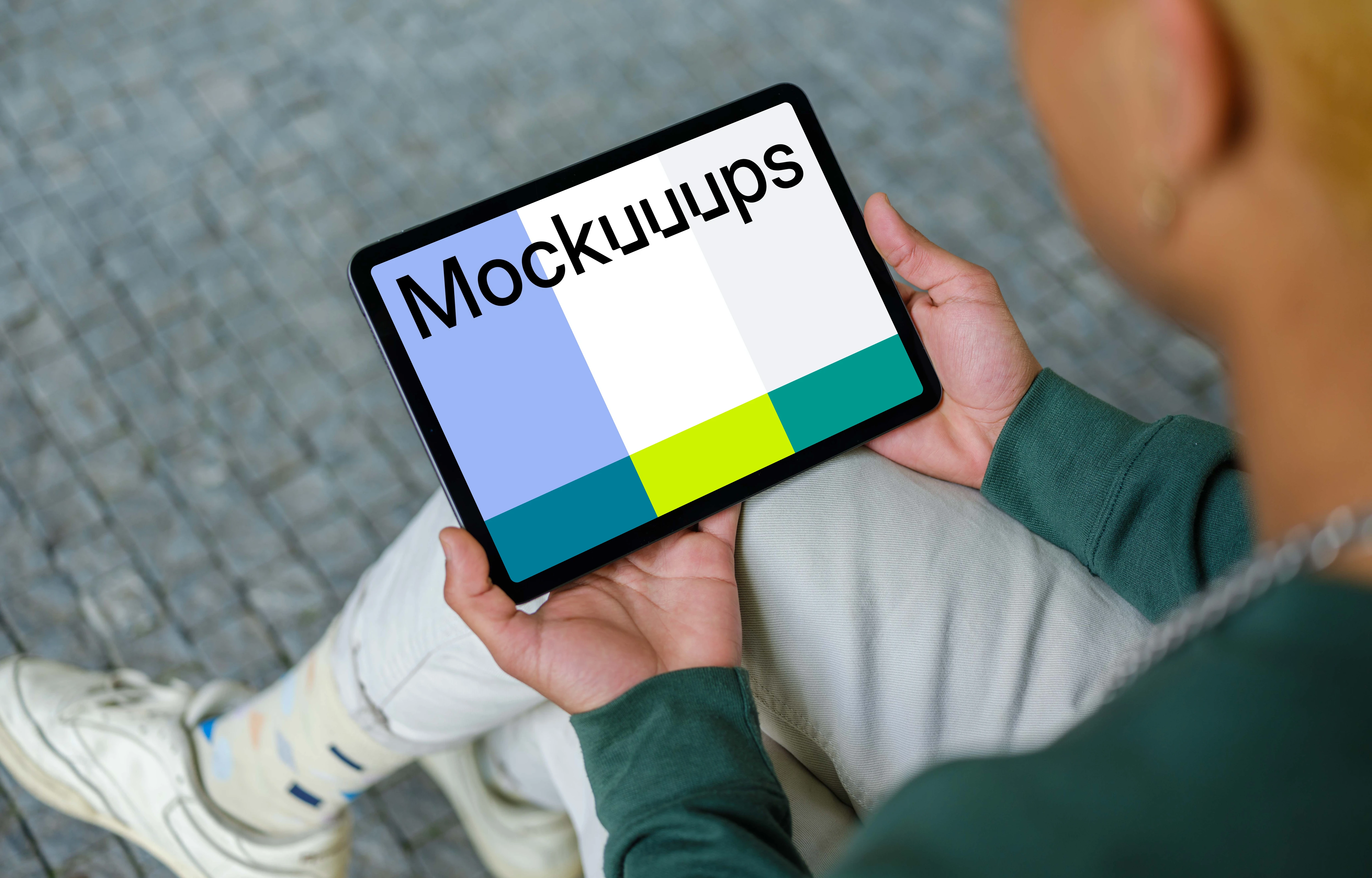 Young man holding iPad mockup