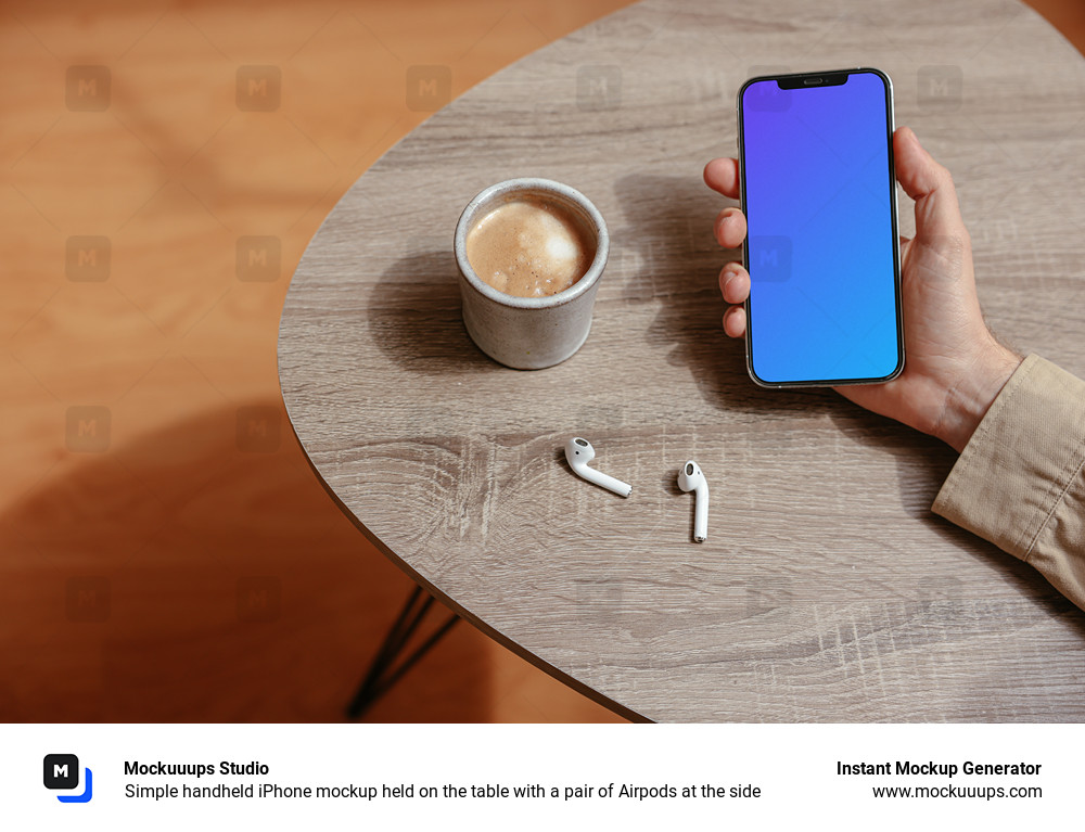 Simple handheld iPhone mockup held on the table with a pair of Airpods at the side
