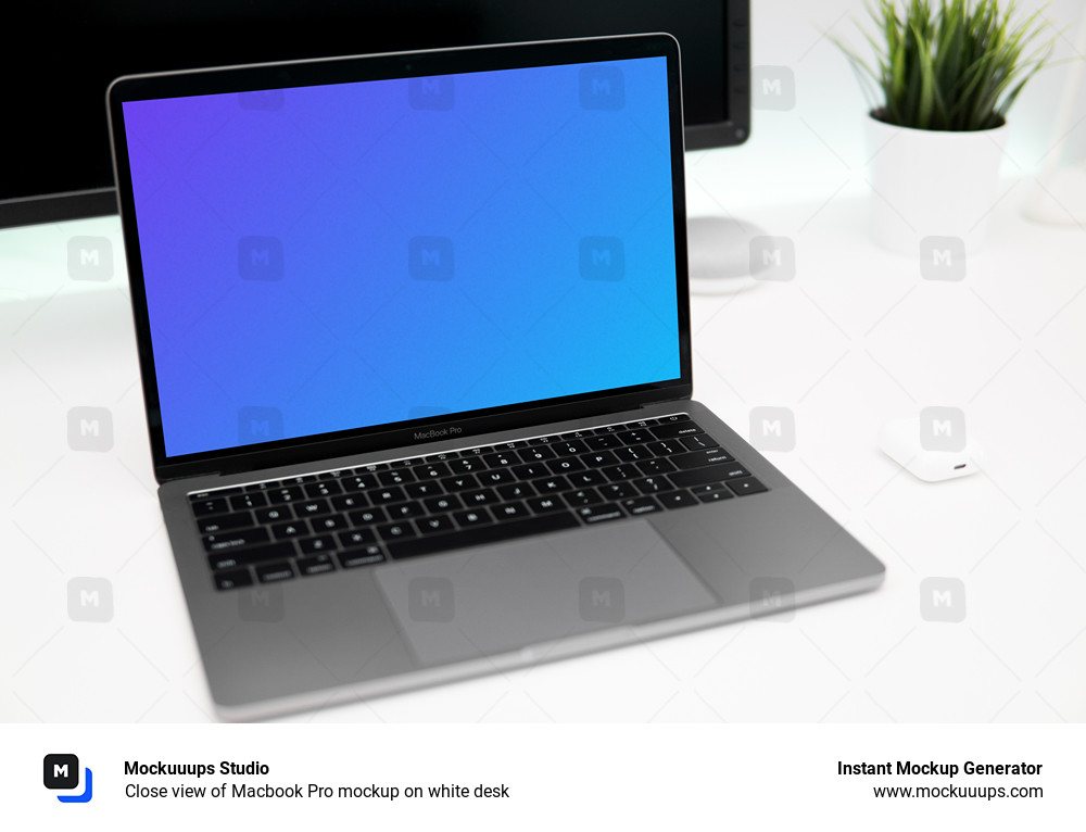 Close view of Macbook Pro mockup on white desk