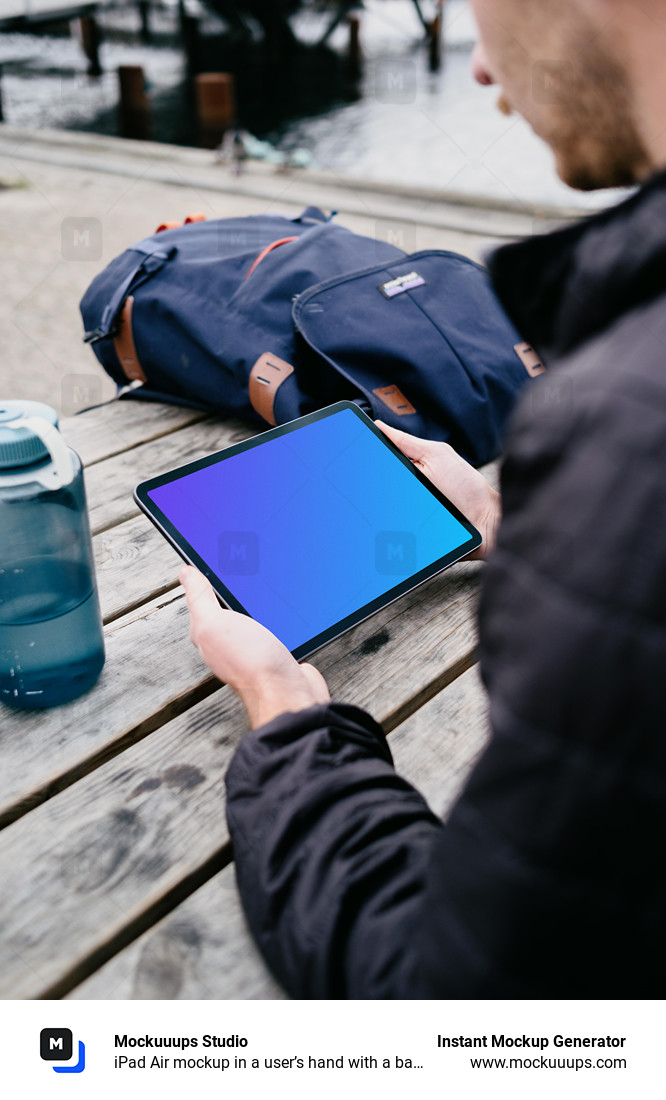 iPad Air mockup in a user’s hand with a backpack in the background