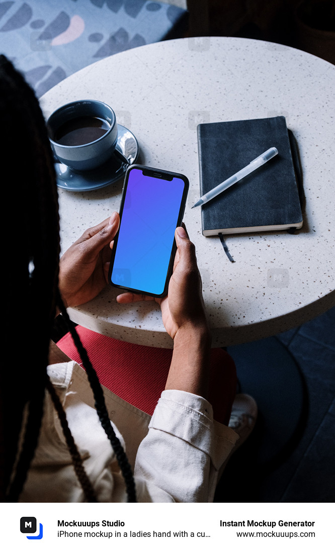 iPhone mockup in a ladies hand with a cup of coffee by the side