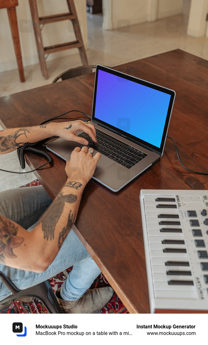 MacBook Pro mockup on a table with a mini-piano by the side
