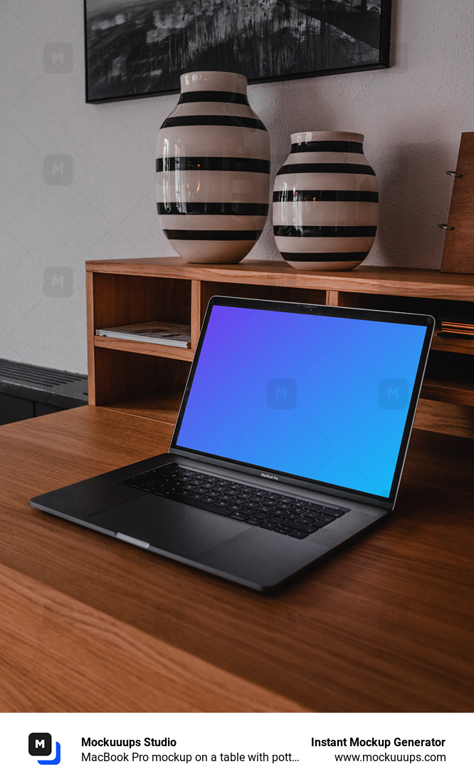 MacBook Pro mockup on a table with pottery above it