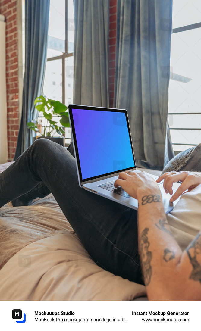 MacBook Pro mockup on man's legs in a bedroom