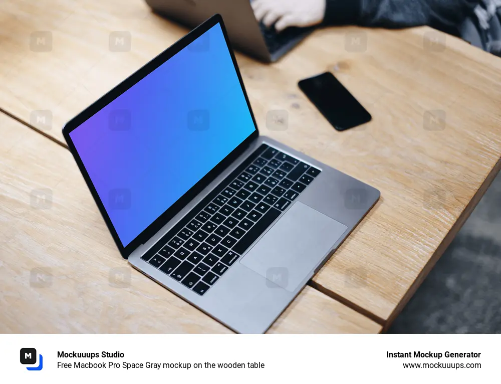 Free Macbook Pro Space Gray mockup on the wooden table