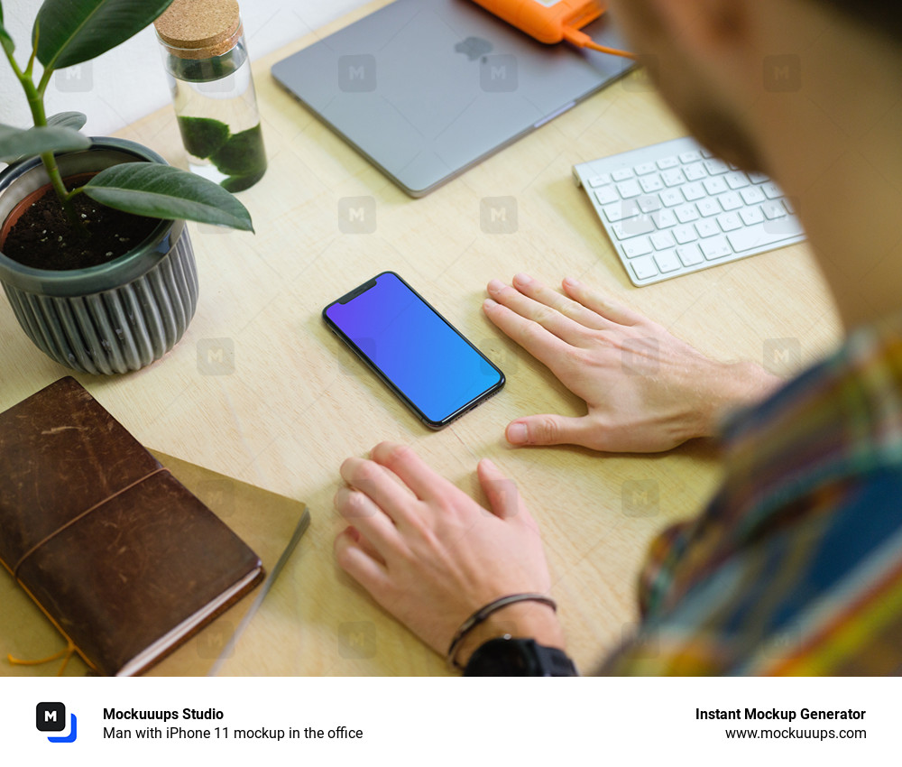 Man with iPhone 11 mockup in the office