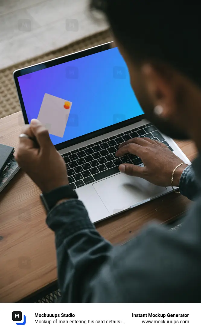 Mockup of man entering his card details into his MacBook 