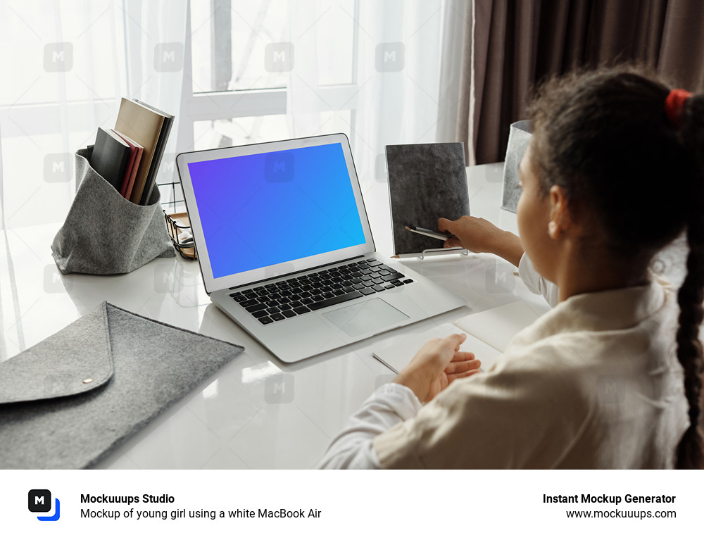 Mockup of young girl using a white MacBook Air