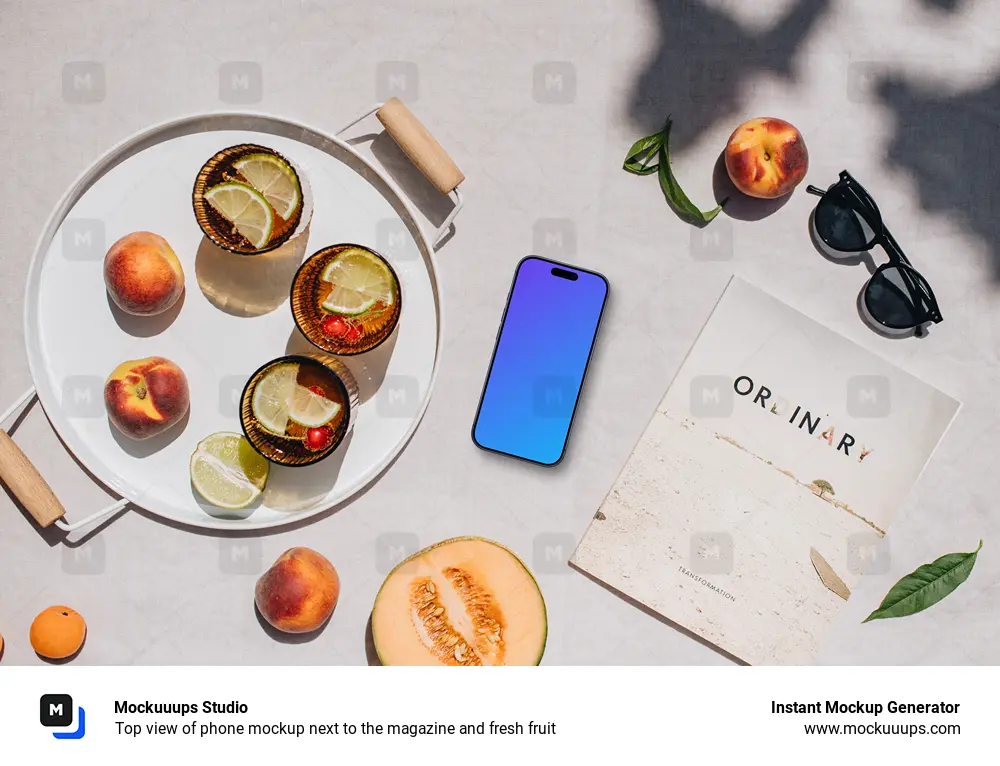 Top view of phone mockup next to the magazine and fresh fruit