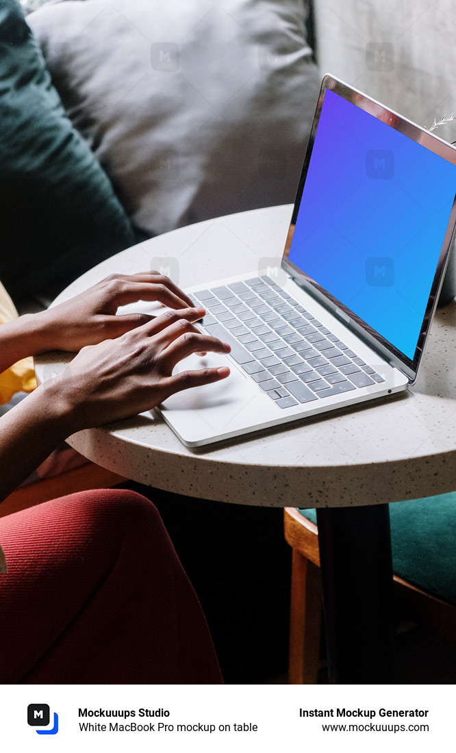 White MacBook Pro mockup on table