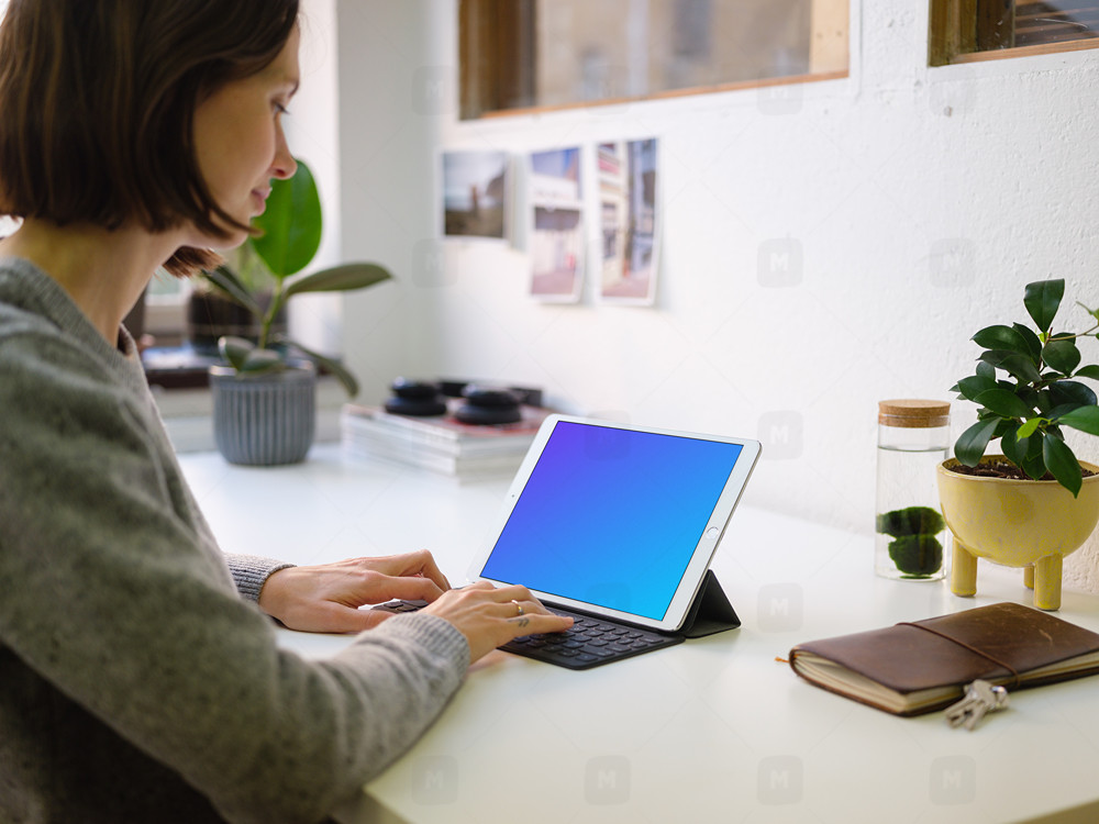 Young woman working on the iPad Pro mockup