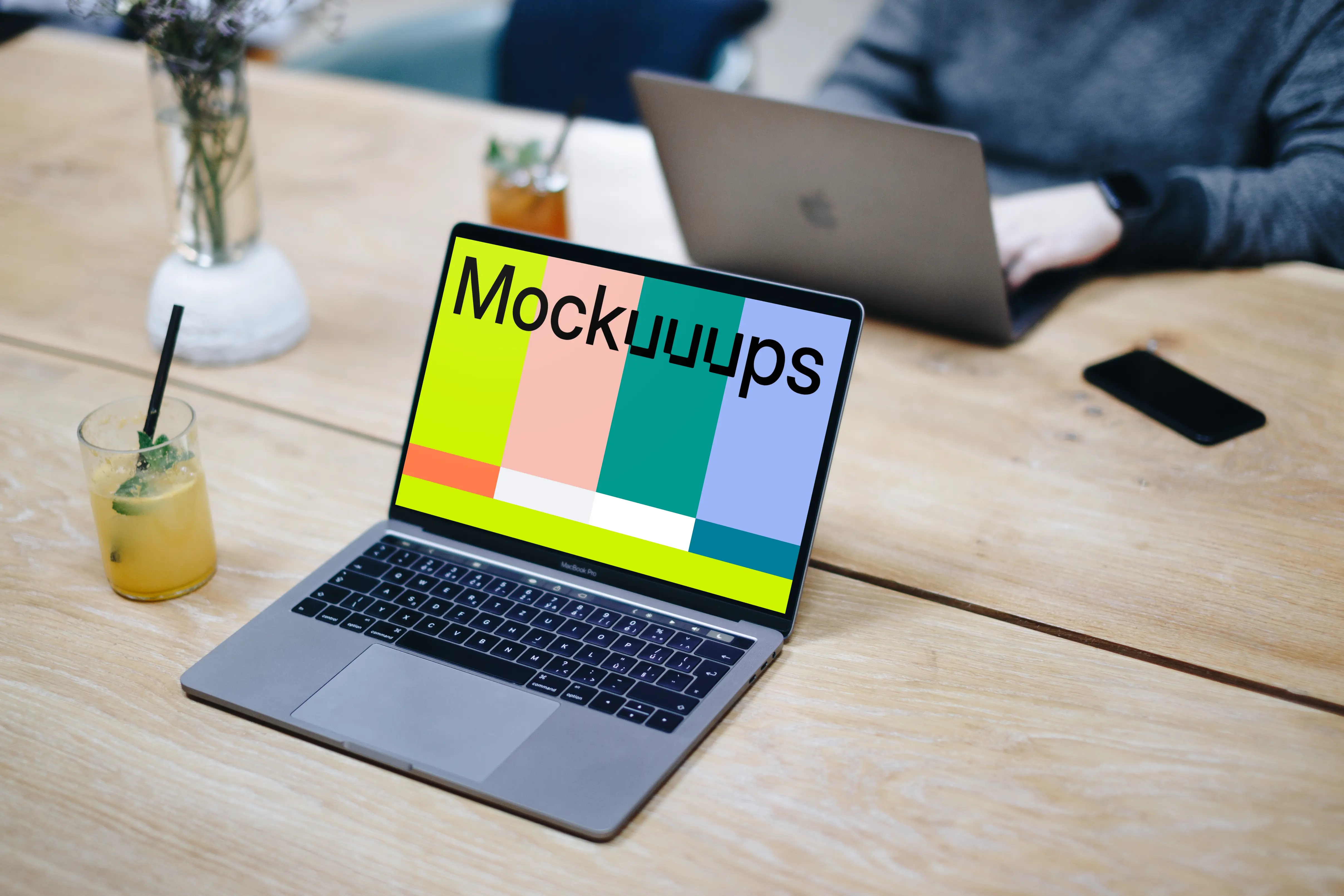 Angle view mockup of Macbook Pro on the wooden table