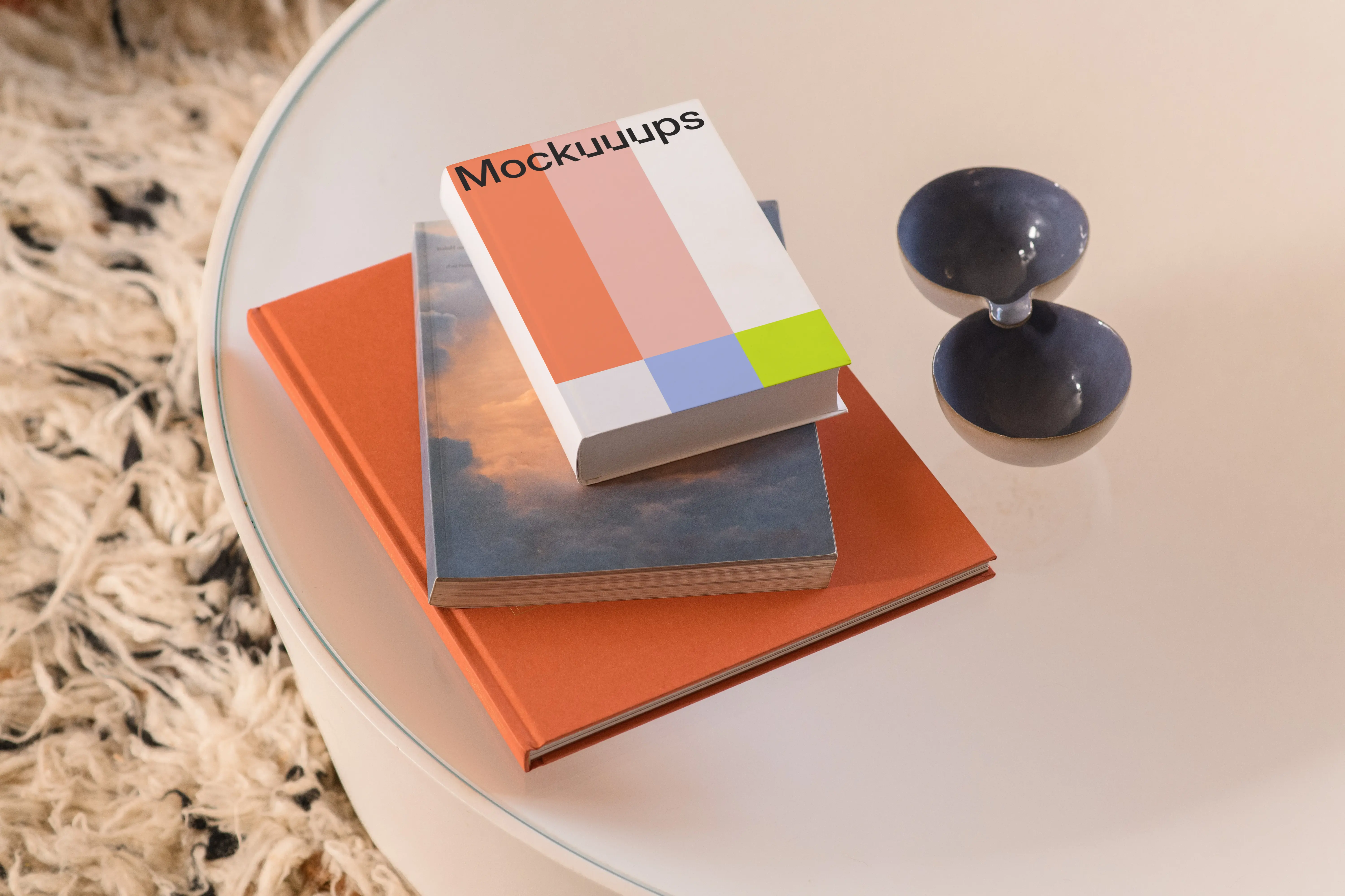 B-format book mockup on a glass table with decor