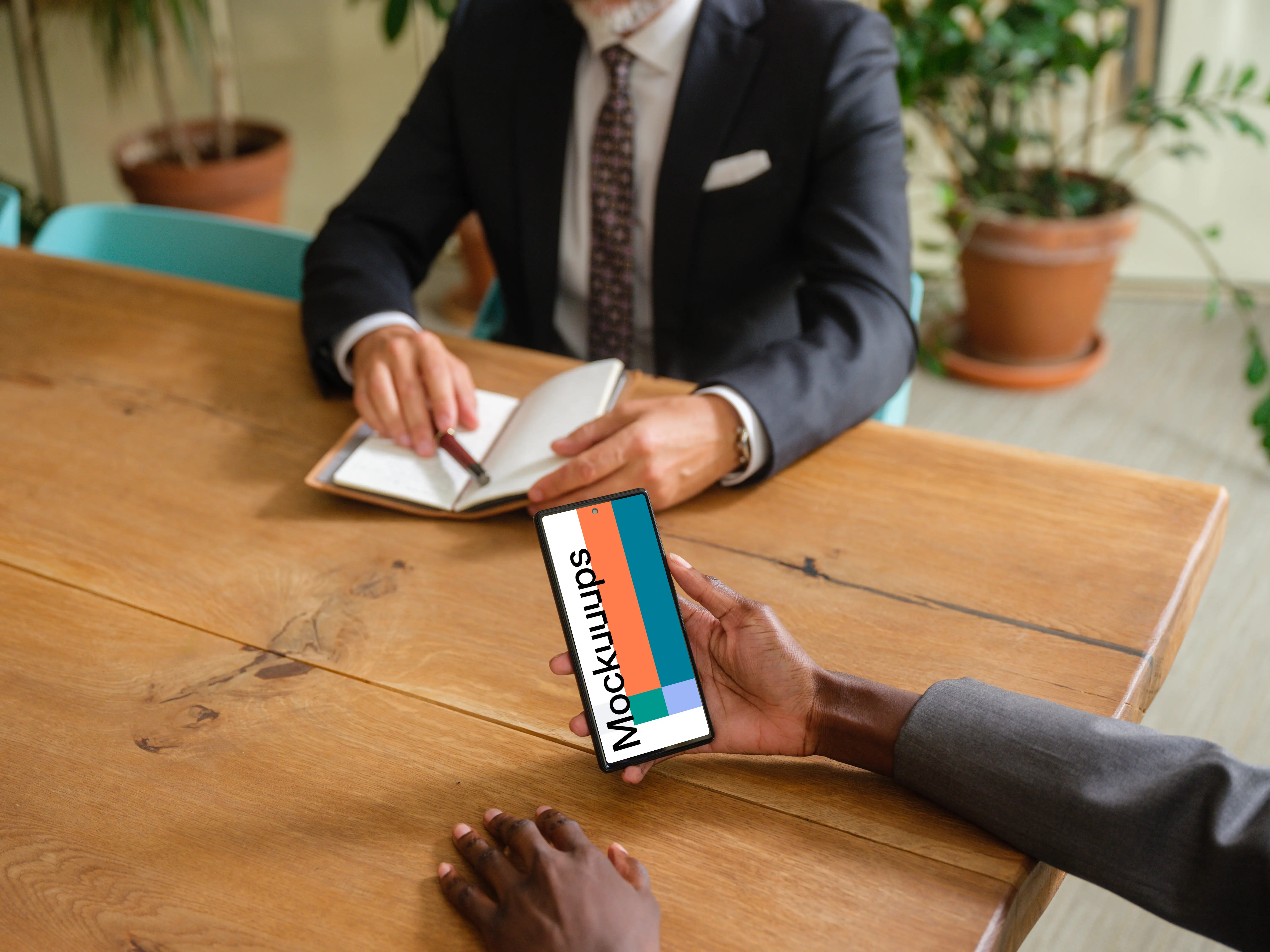 Business woman working on phone in business meeting