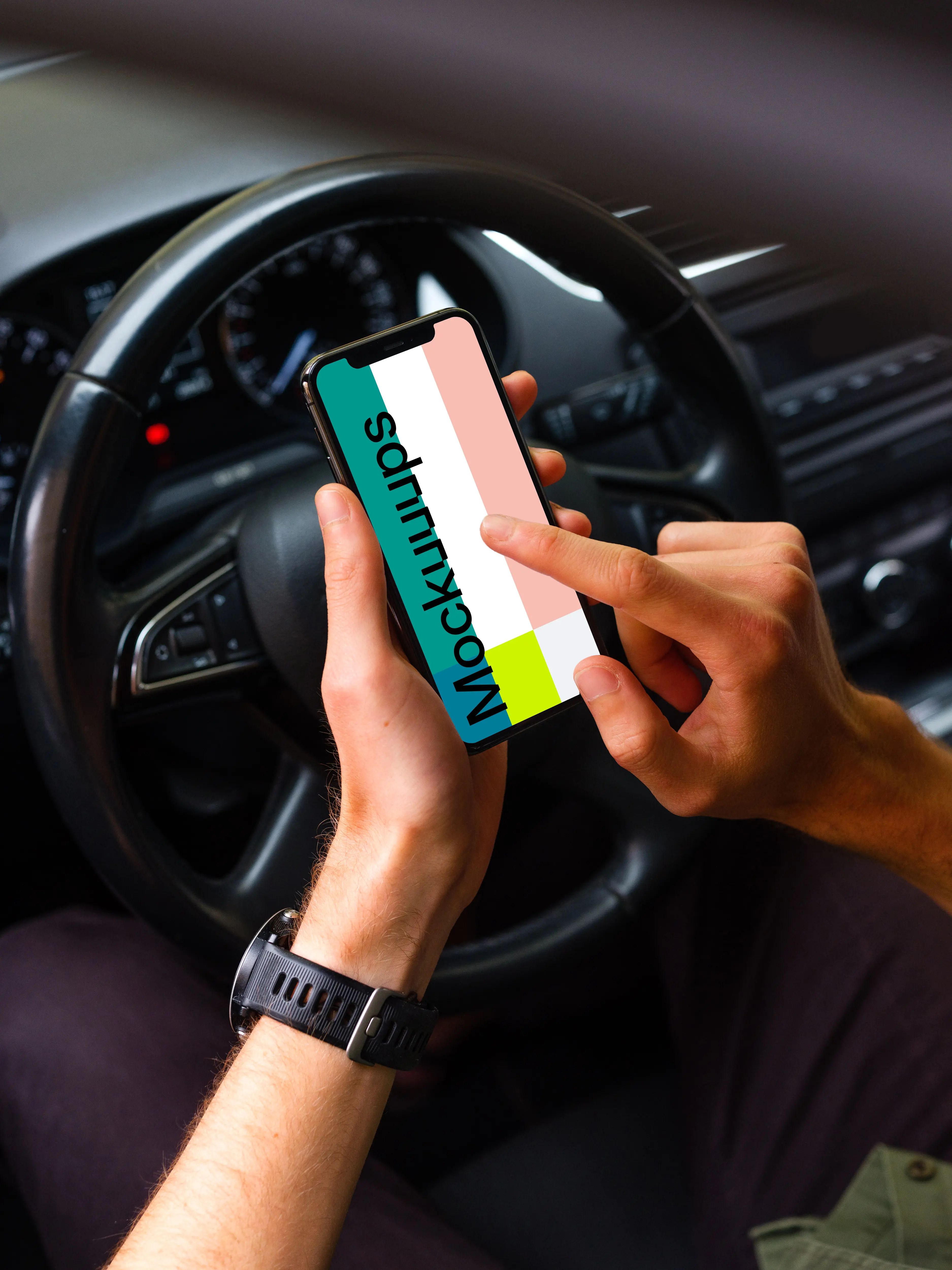 Driver tapping iPhone 11 mockup in front of steering wheel