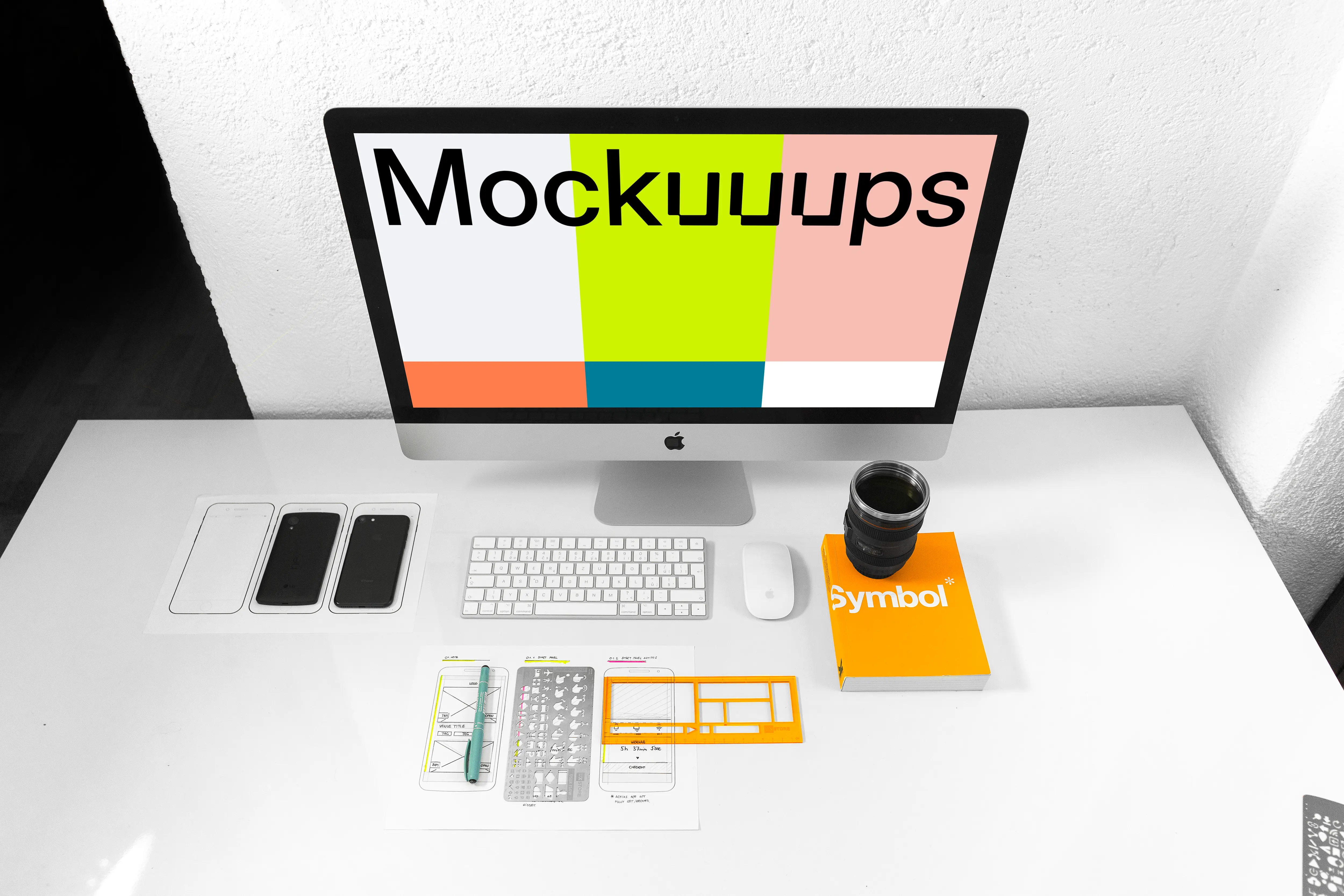 Front view of iMac mockup on white working desk