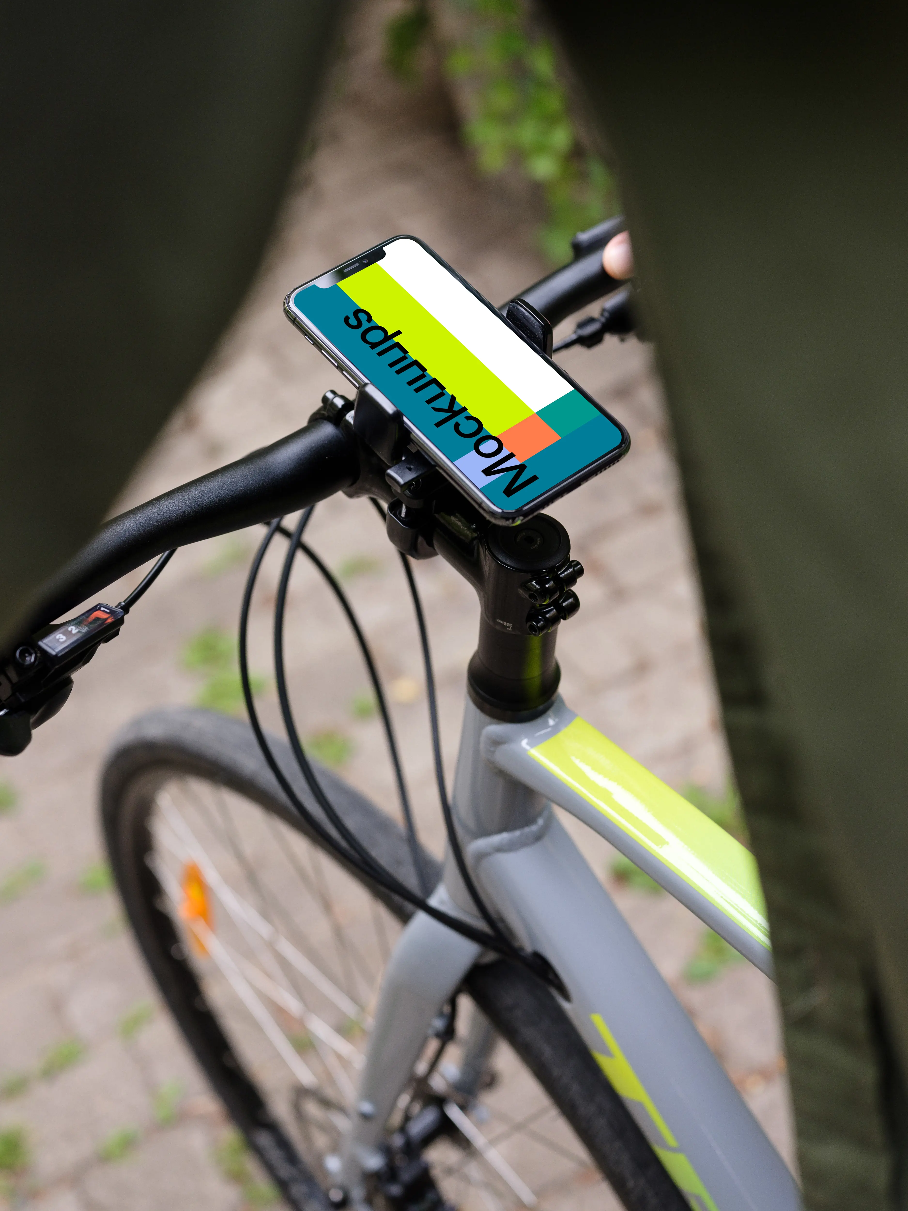 Front view of iPhone 11 Pro mockup in bike mount while riding