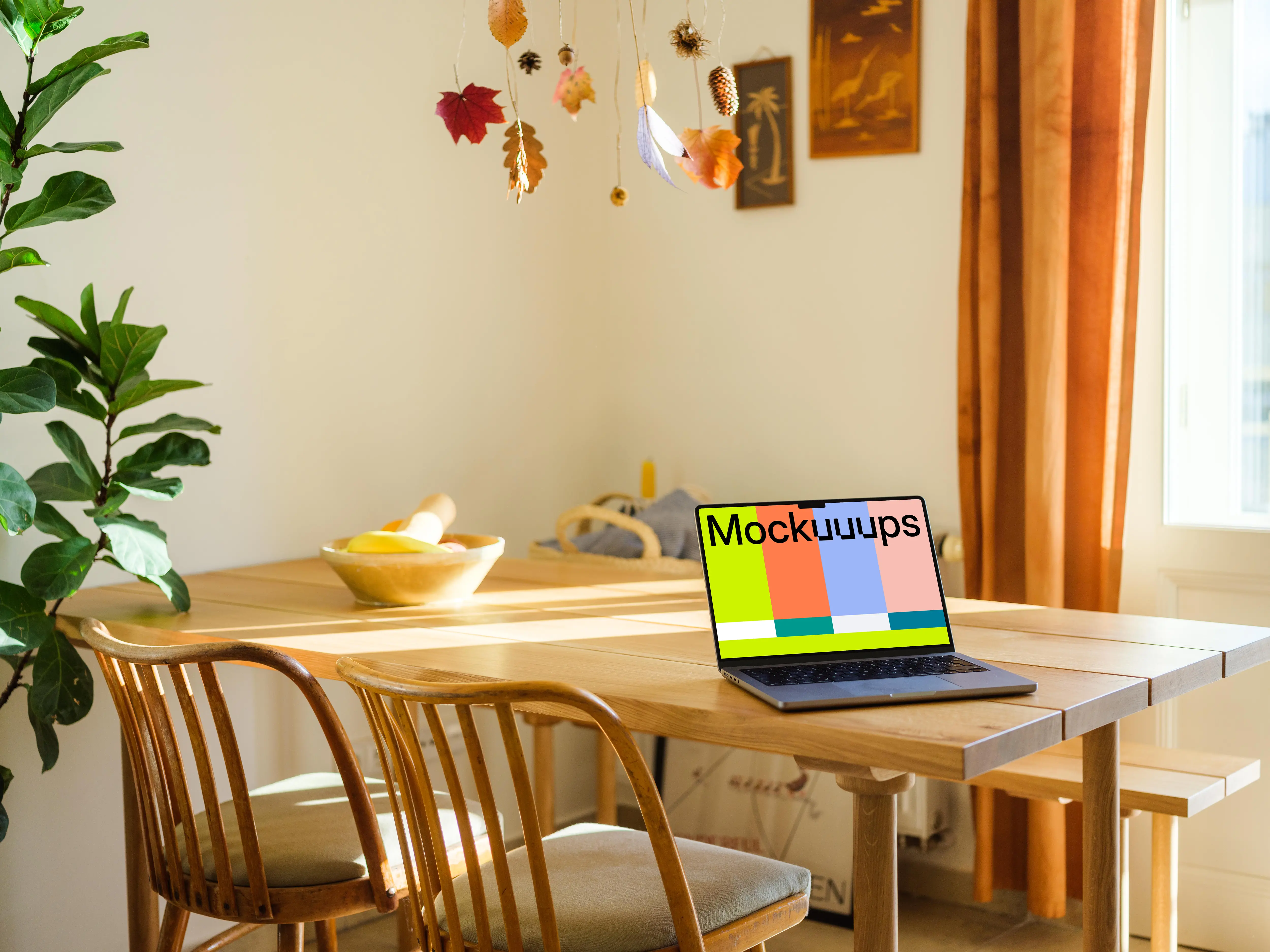 Grey MacBook Pro mockup on a dining table