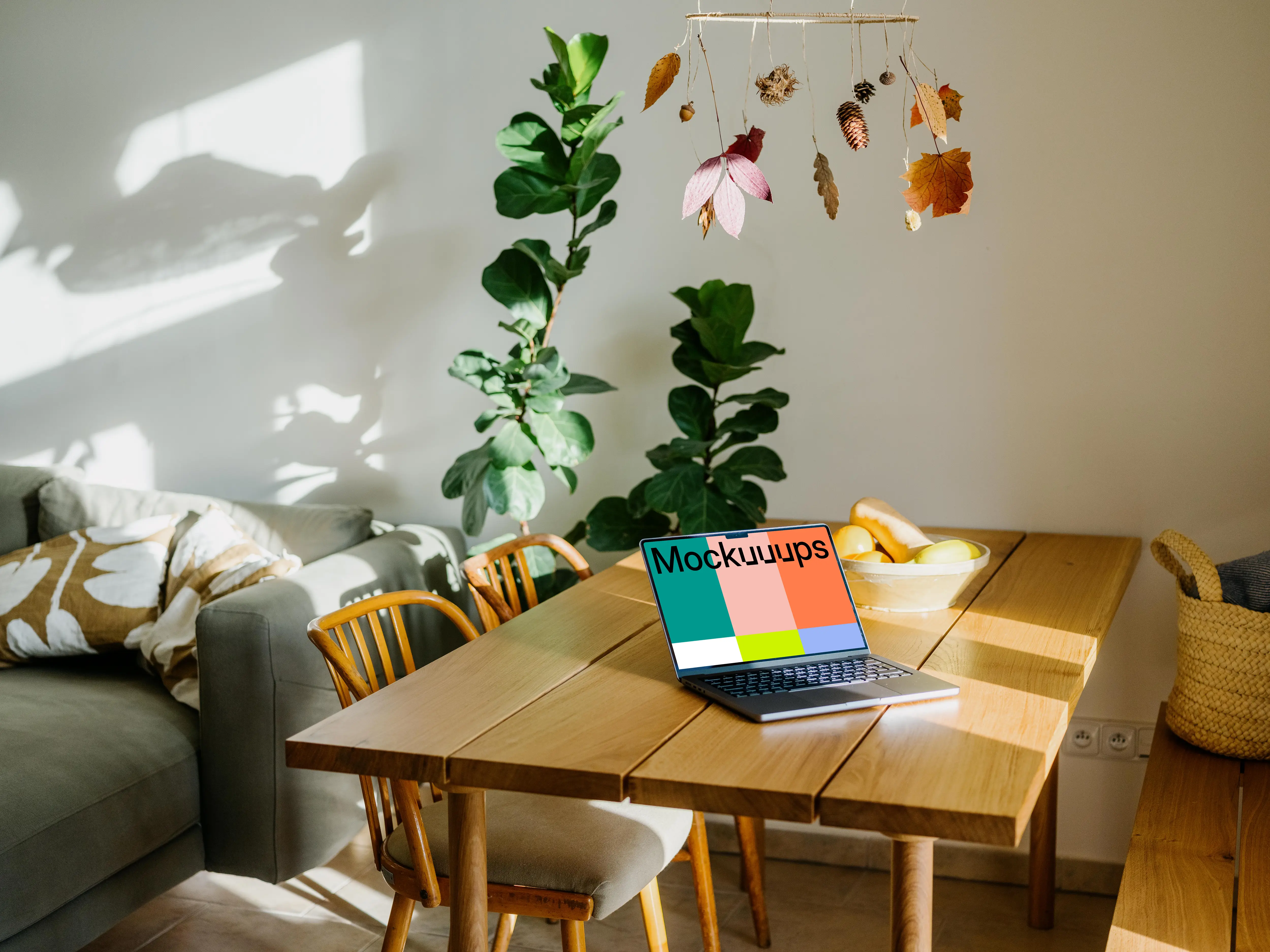Grey MacBook Pro mockup on a table in a living room