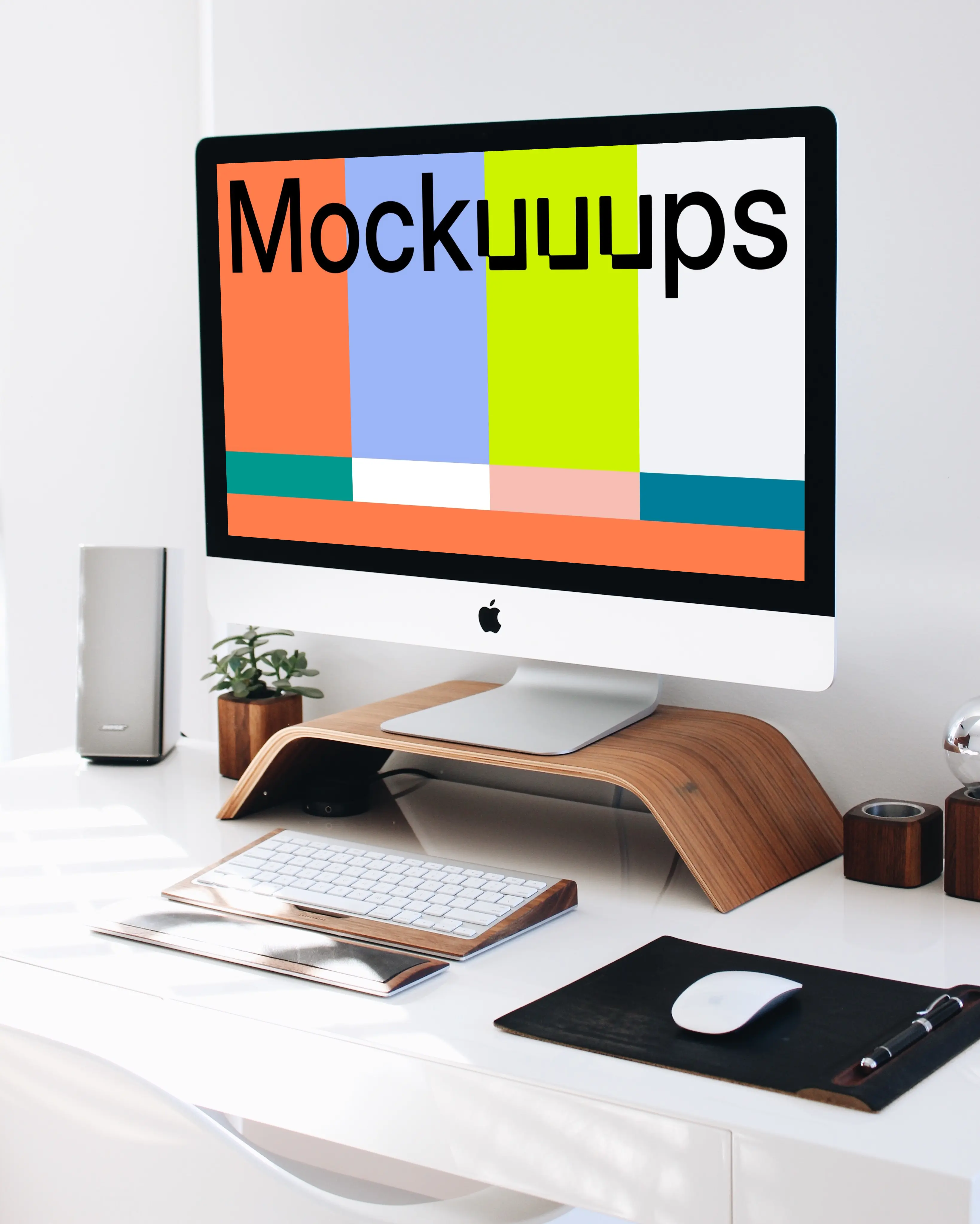 iMac mockup on a wooden stand in a home workstation