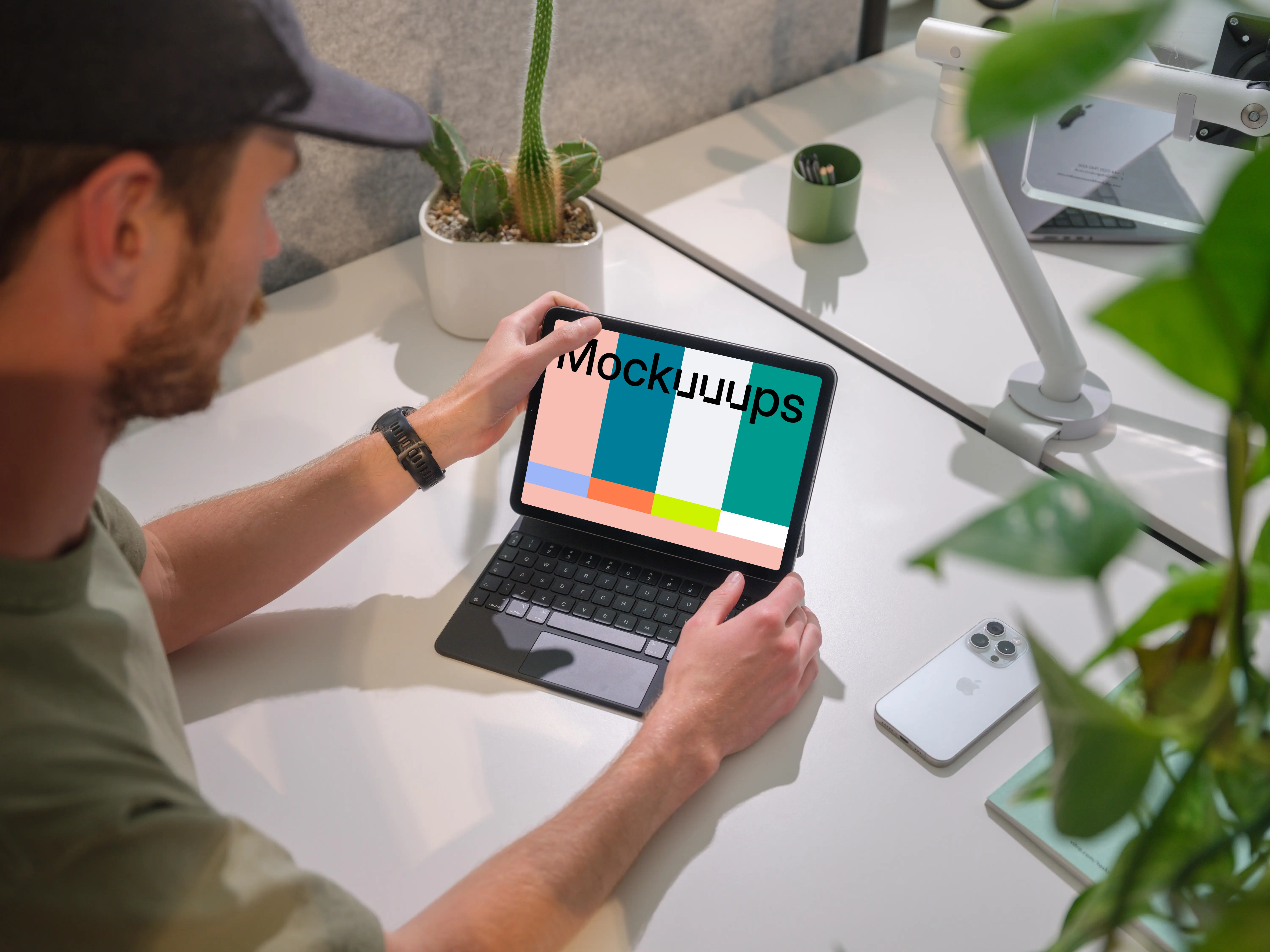 iPad Air mockup in a modern office held by a man