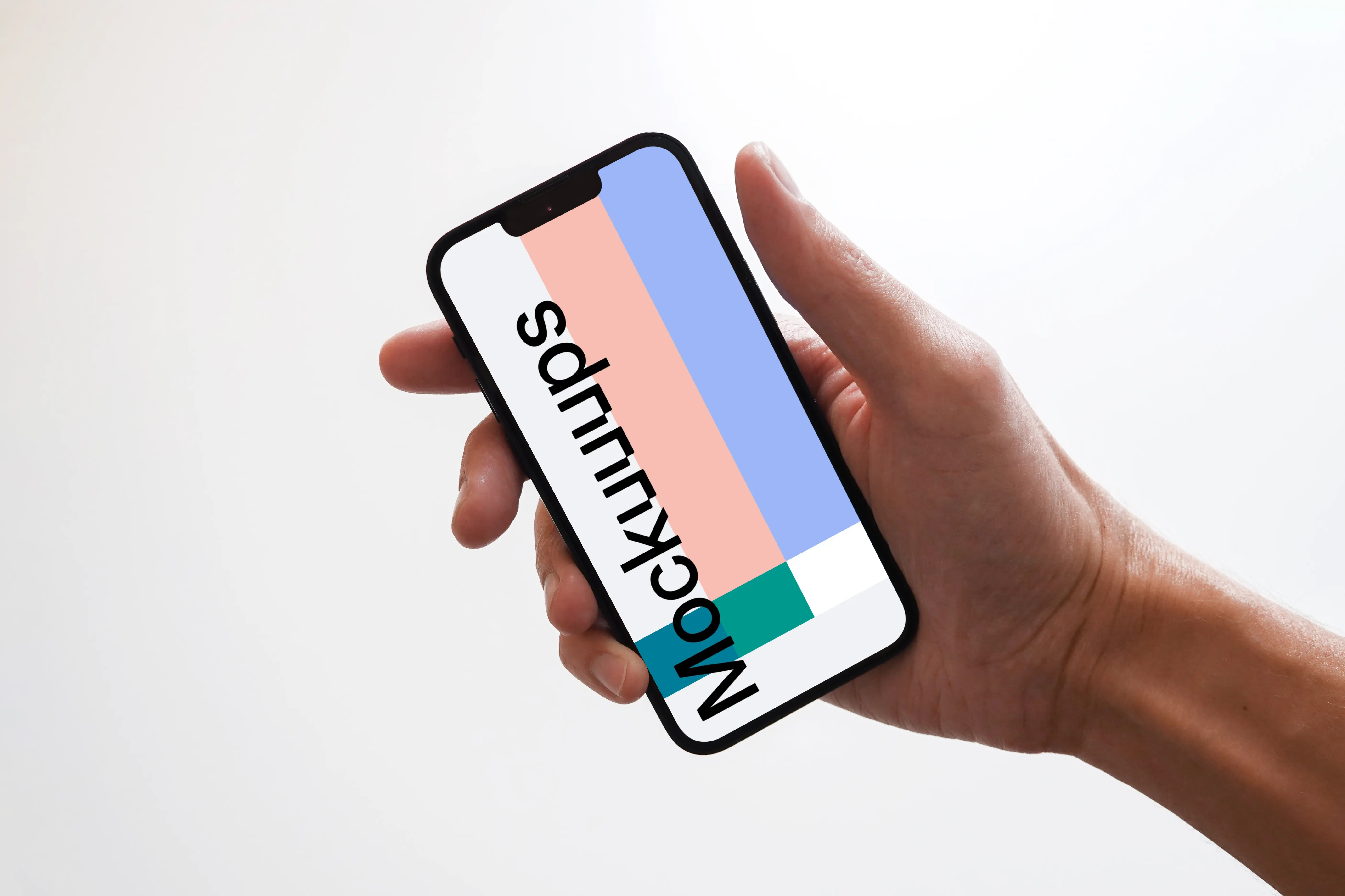 iPhone 13 mockup held by user against plain white surface