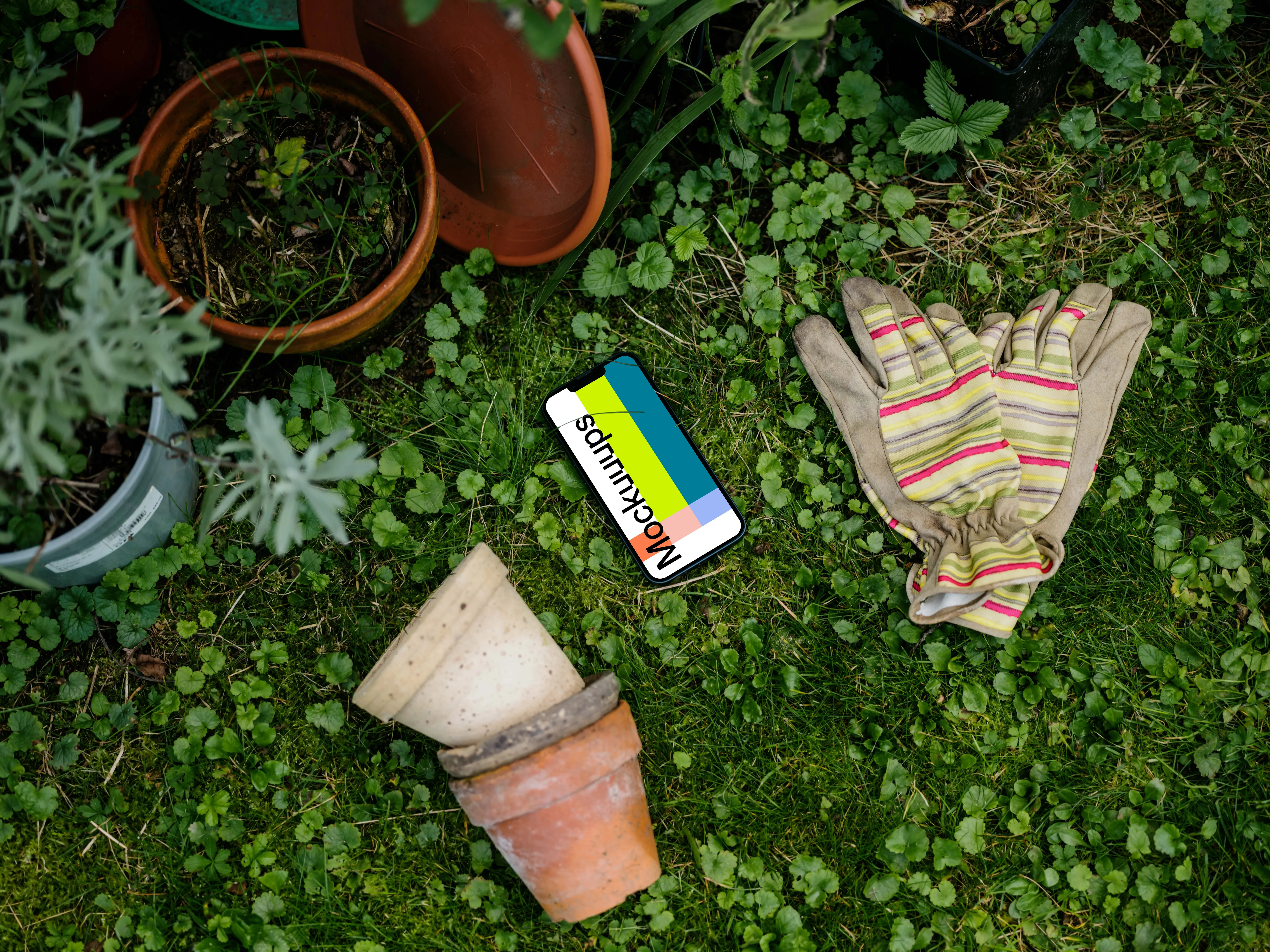 iPhone 13 mockup in garden