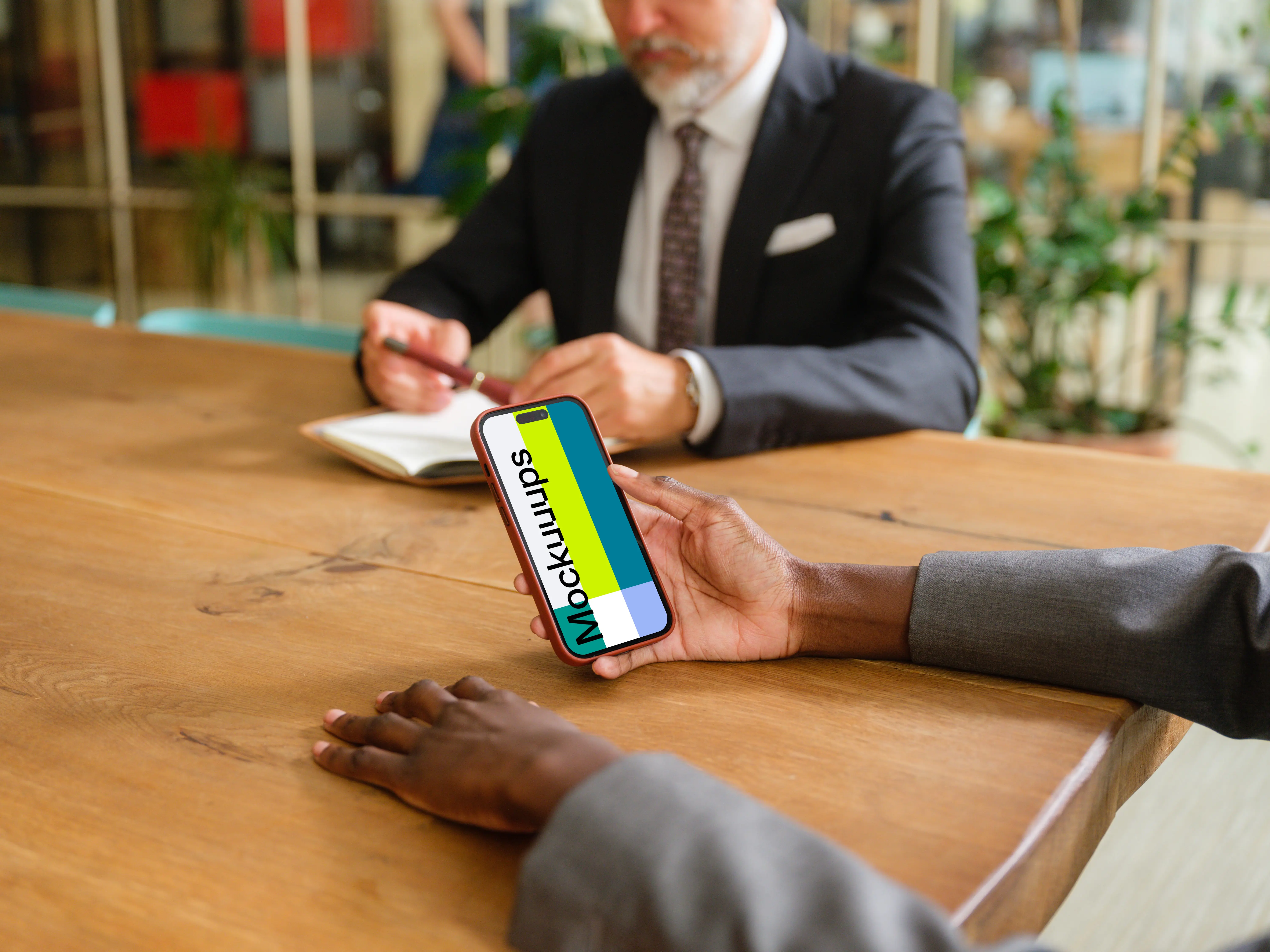 iPhone 14 Pro mockup in businesswoman’s hand