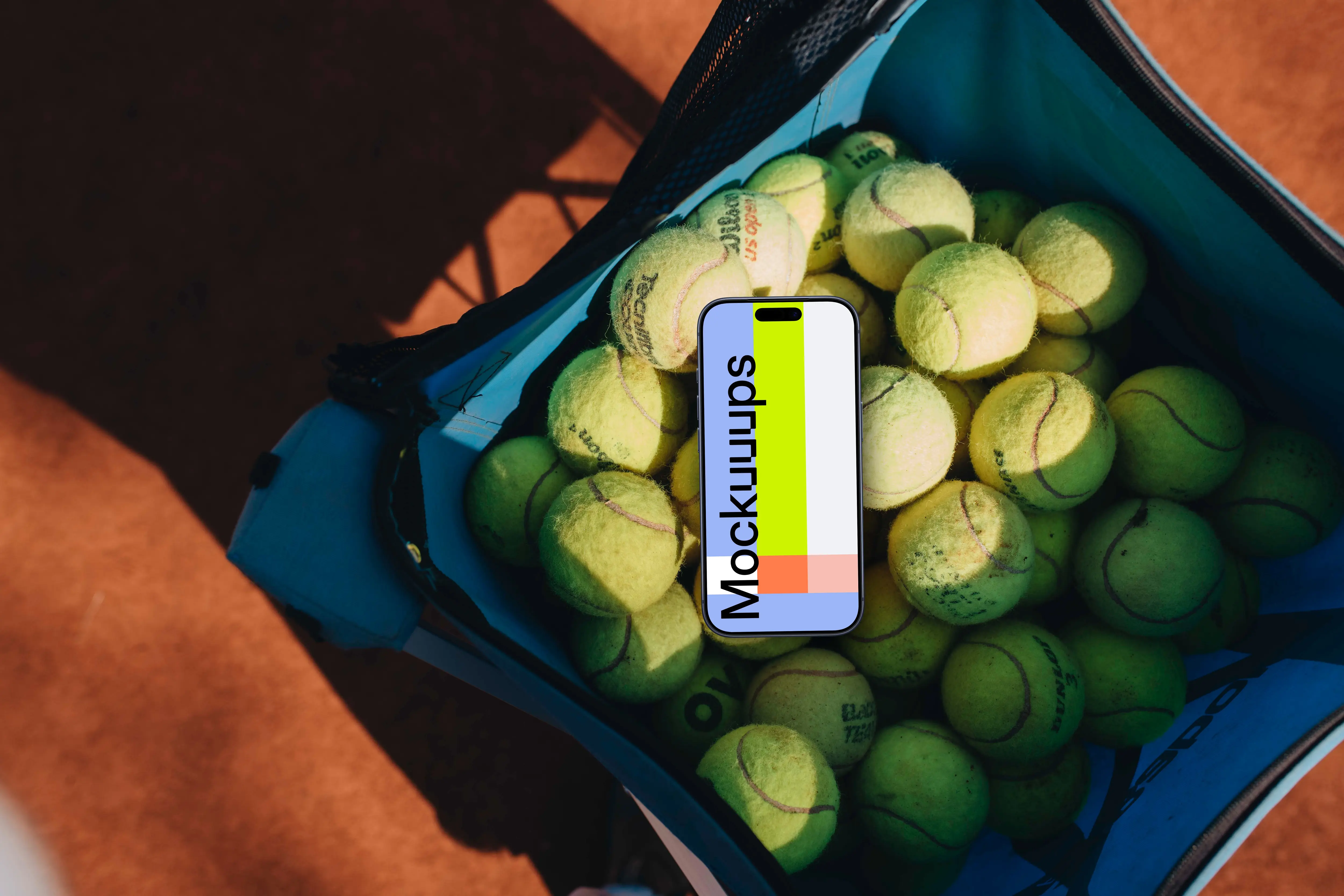 iPhone mockup in a bag full of tennis balls