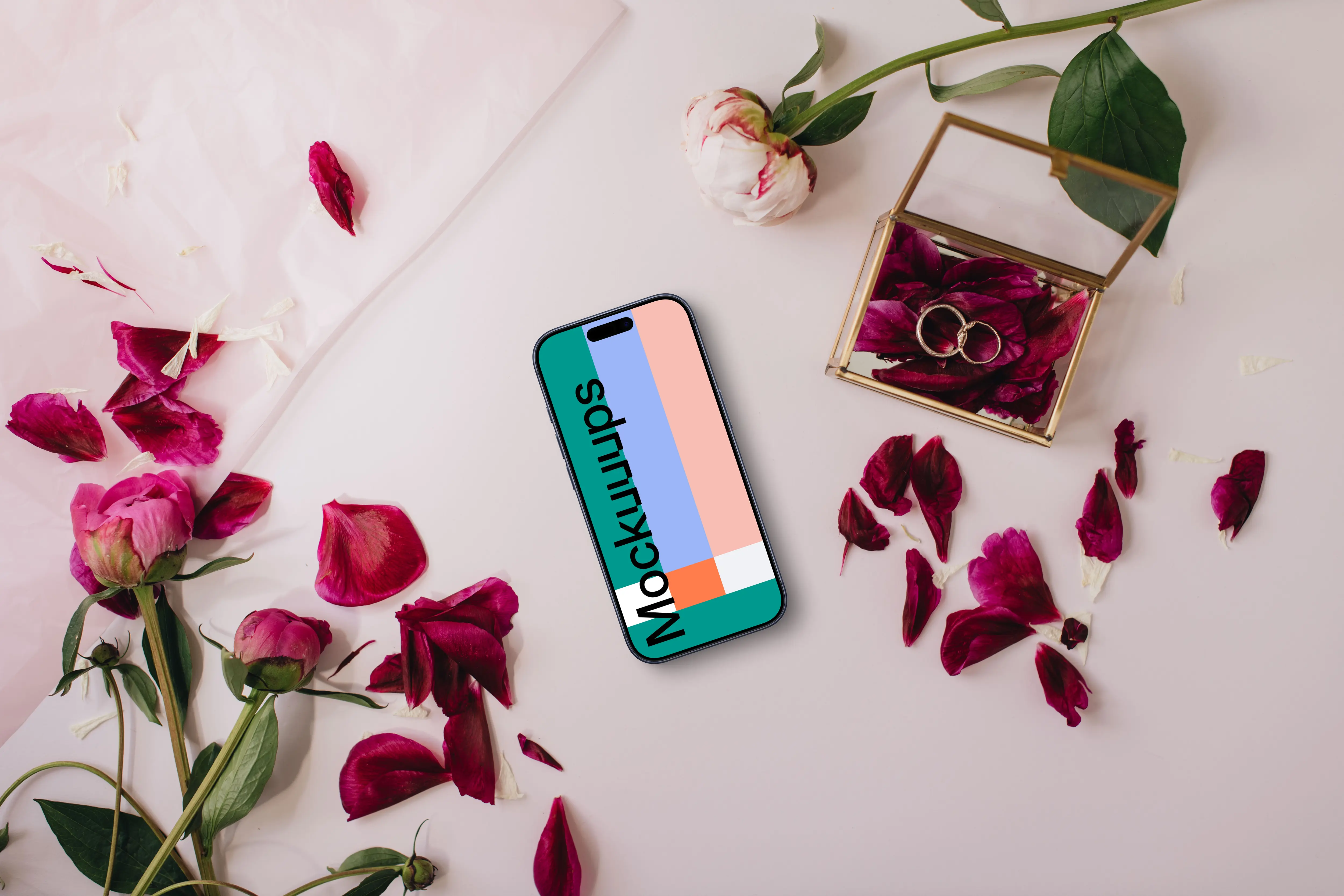 iPhone surrounded by rose petals