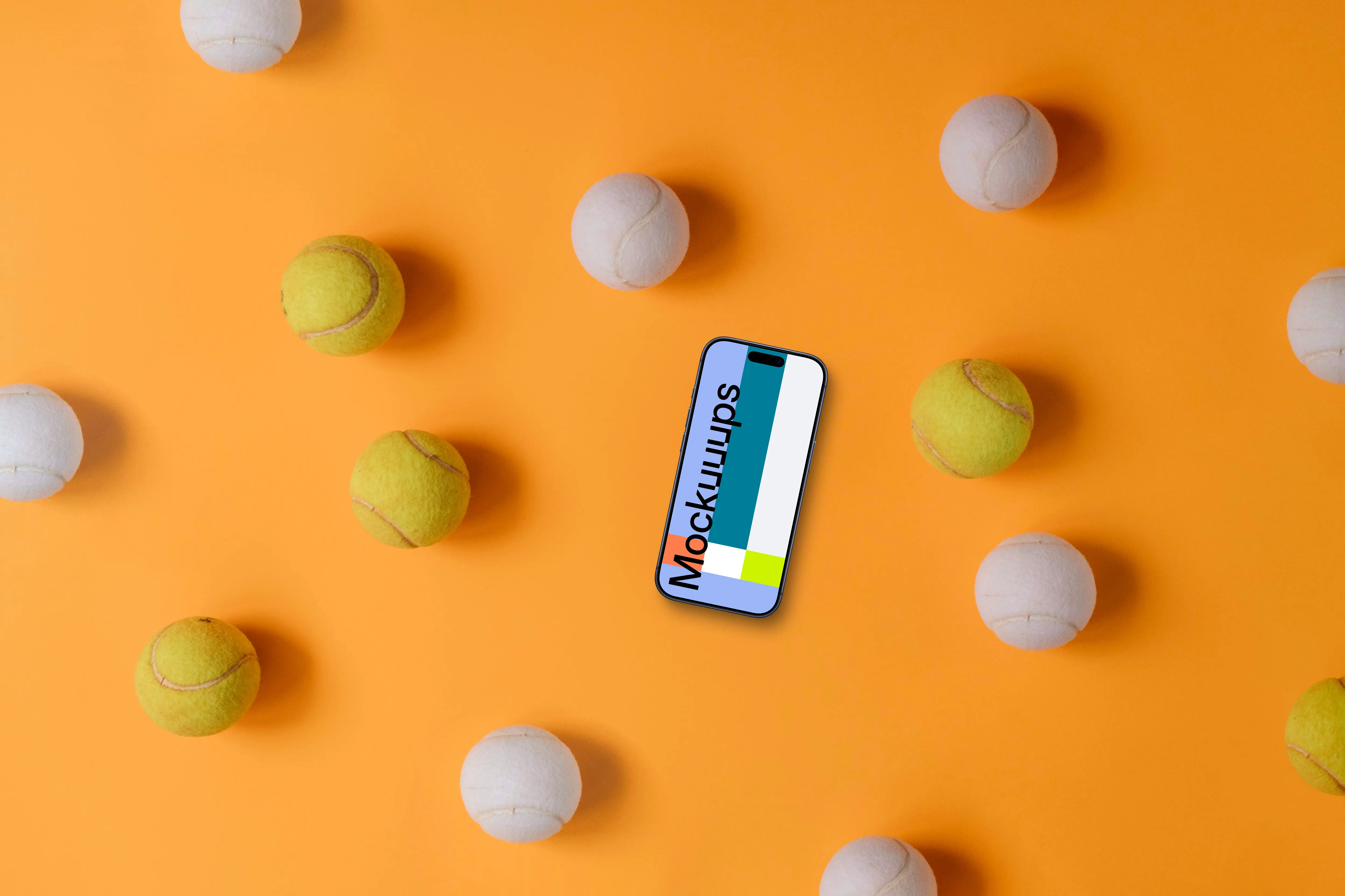 iPhone surrounded by tennis balls