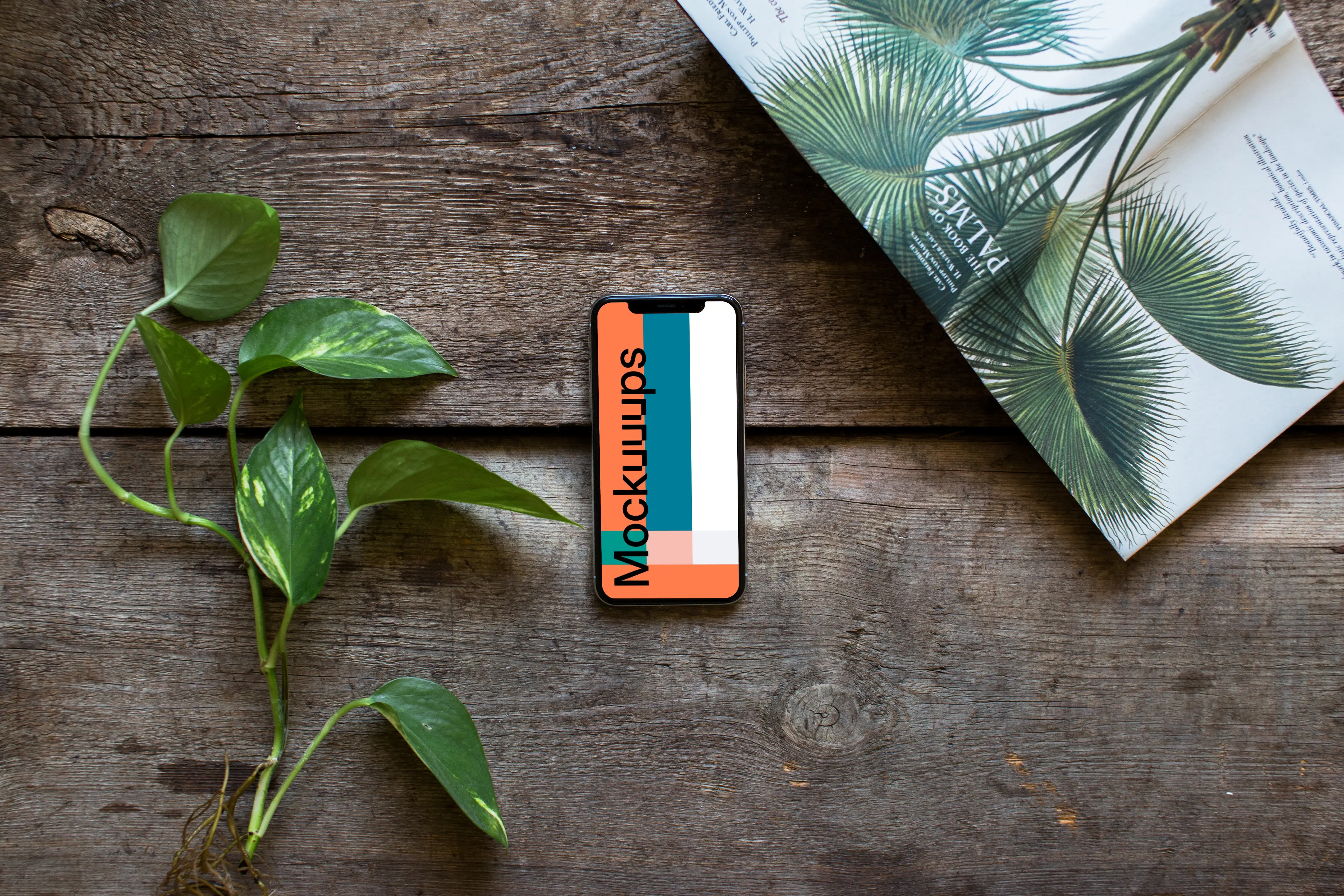 iPhone XS mockup with a book about plants