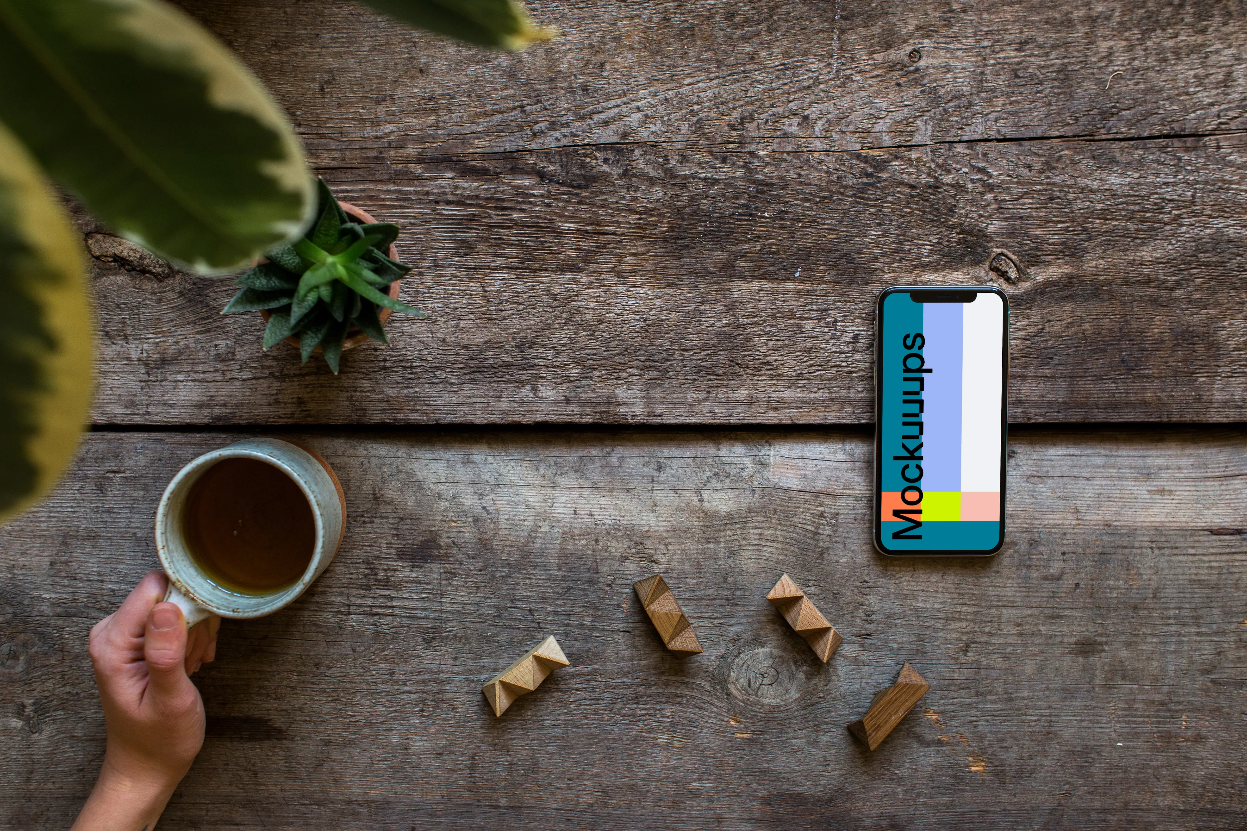 iPhone XS mockup with a tea on the left side