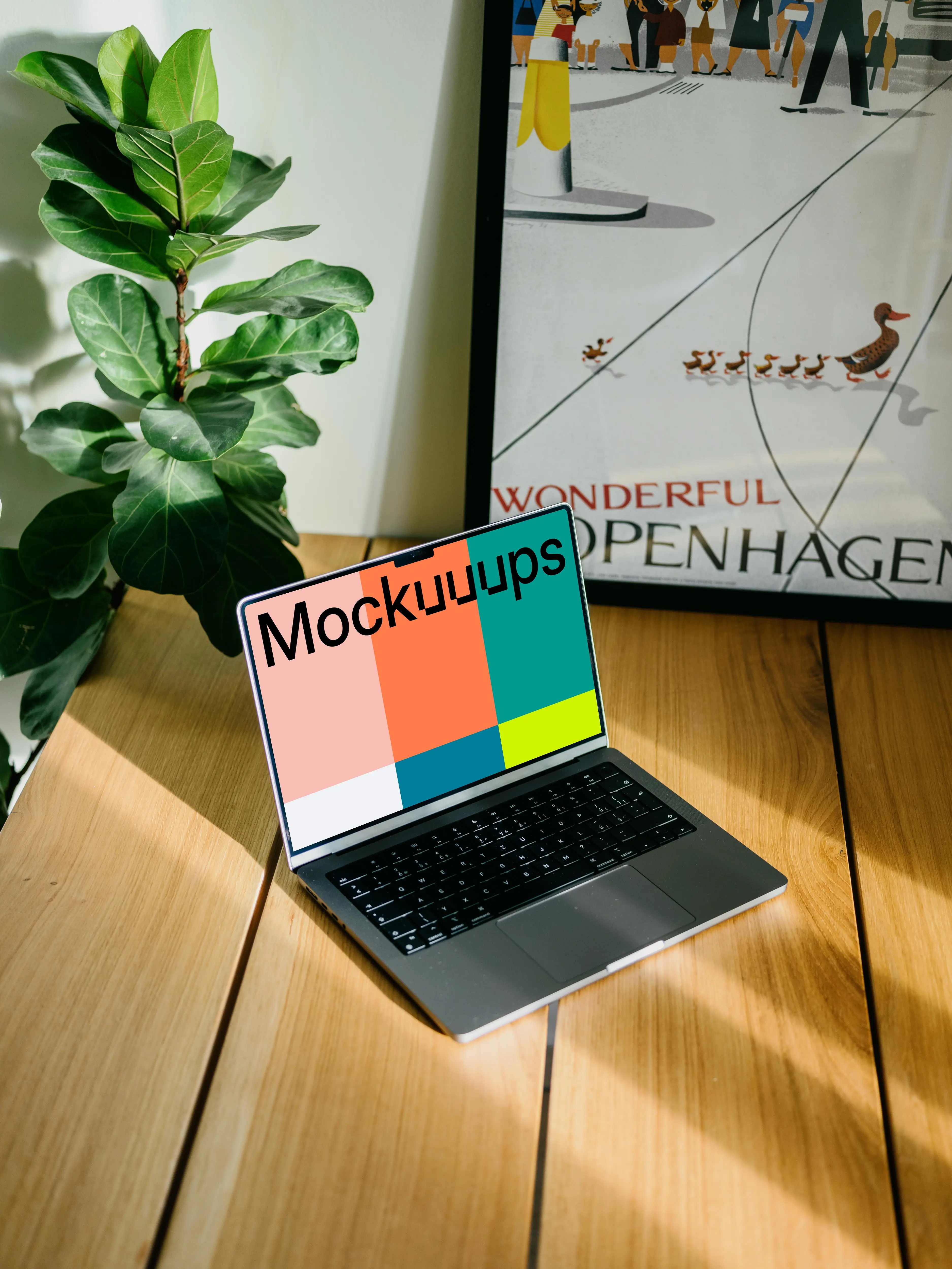 Laptop mockup with a plant in the background