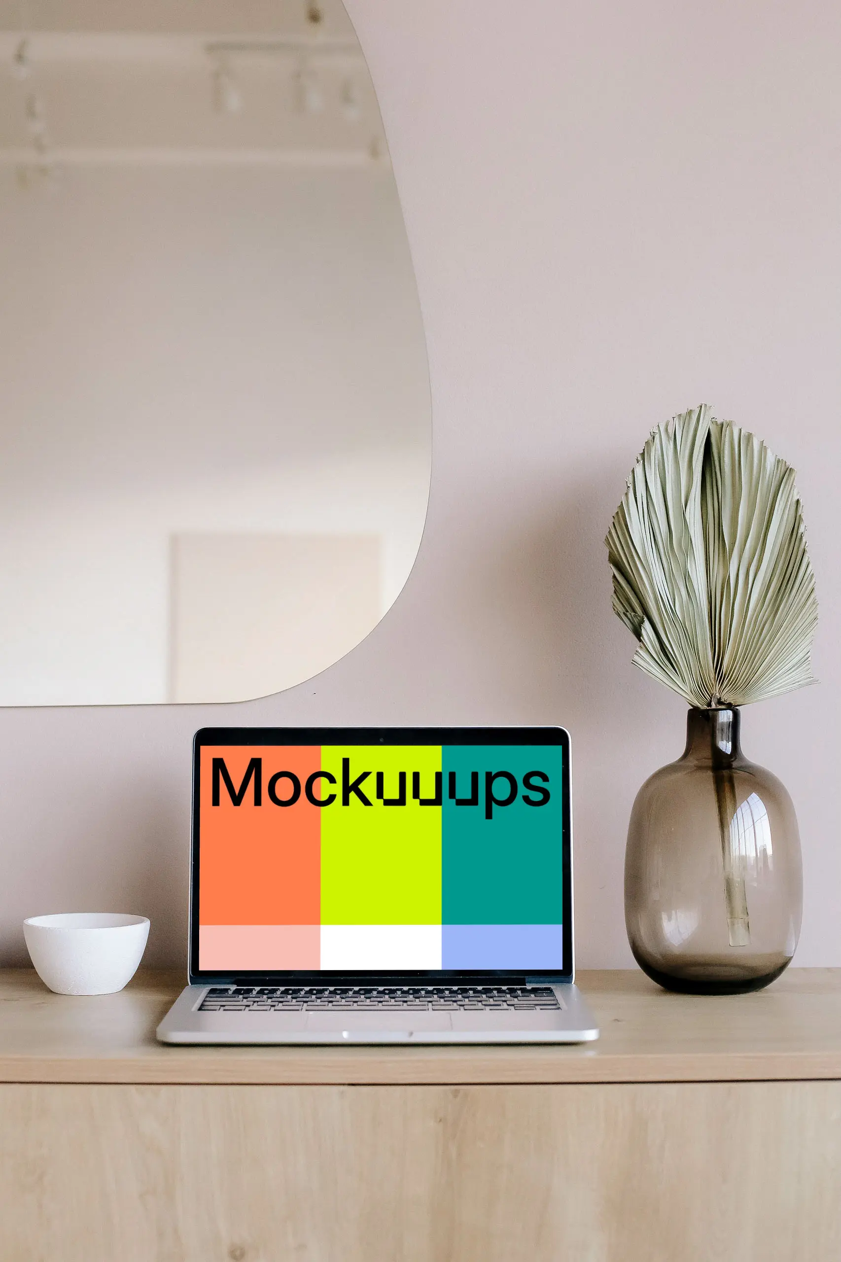 MacBook mockup on a table with mirror in the background 