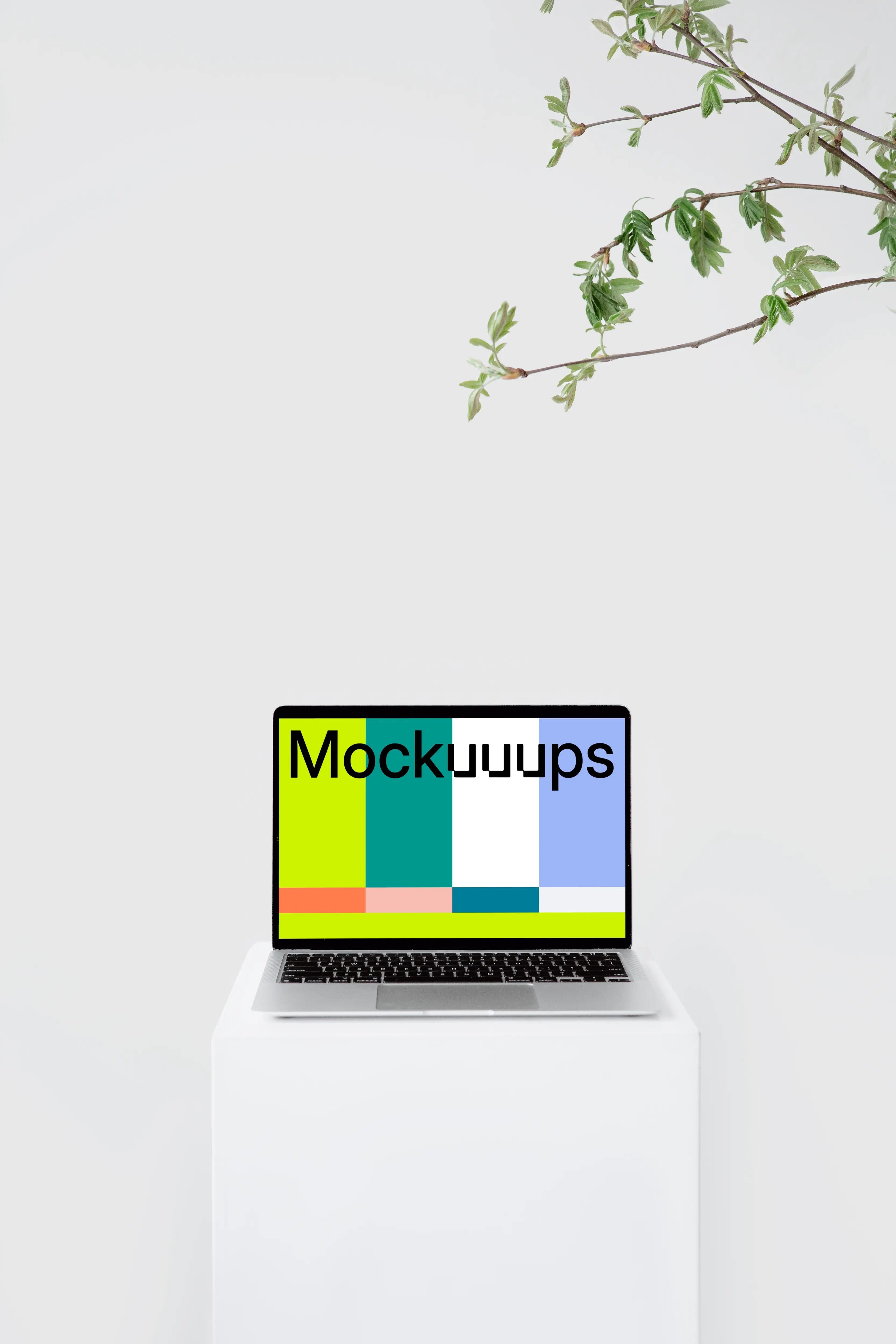MacBook mockup on a tall white stool