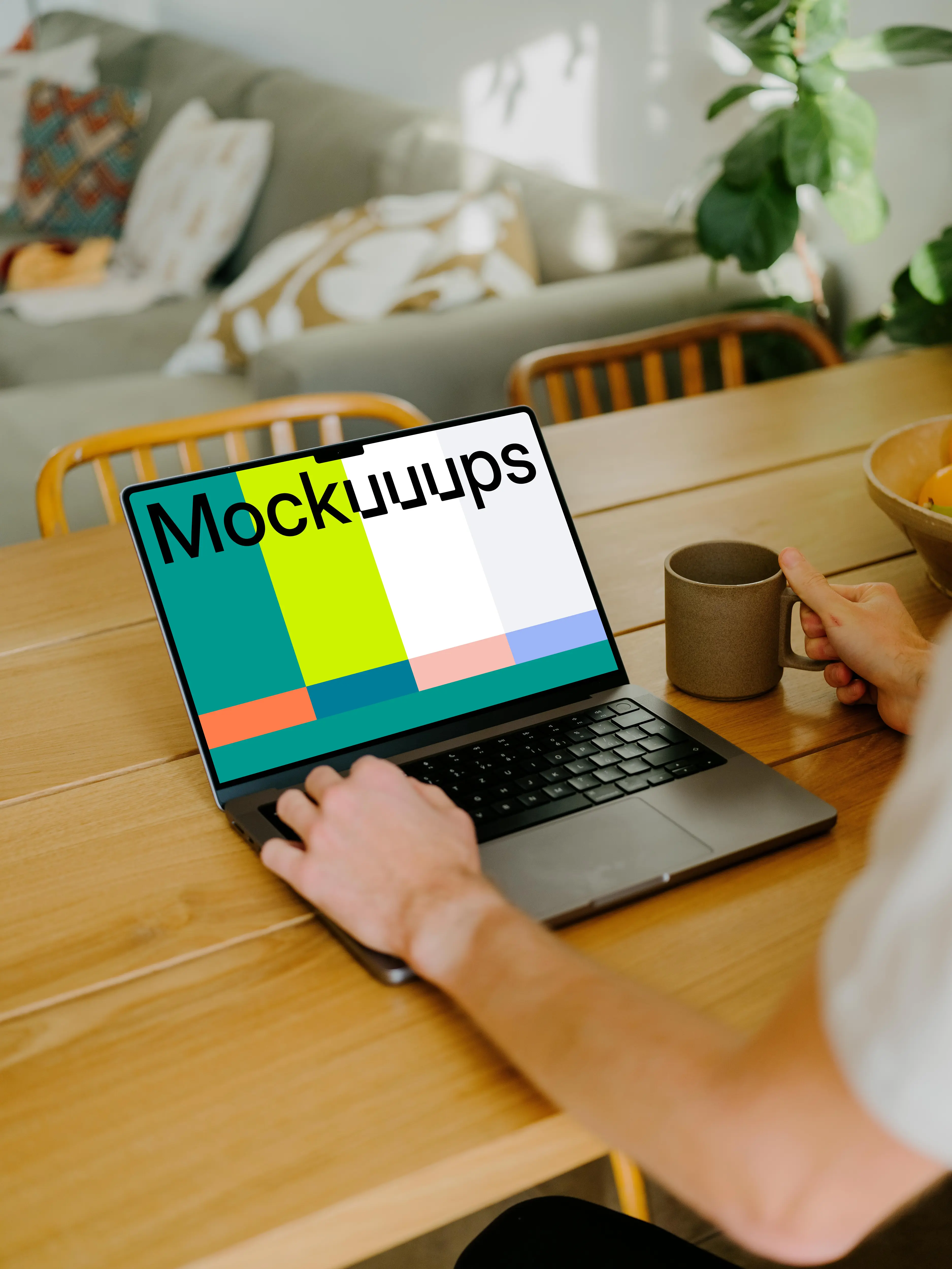 MacBook Pro mockup on a table in front of a user