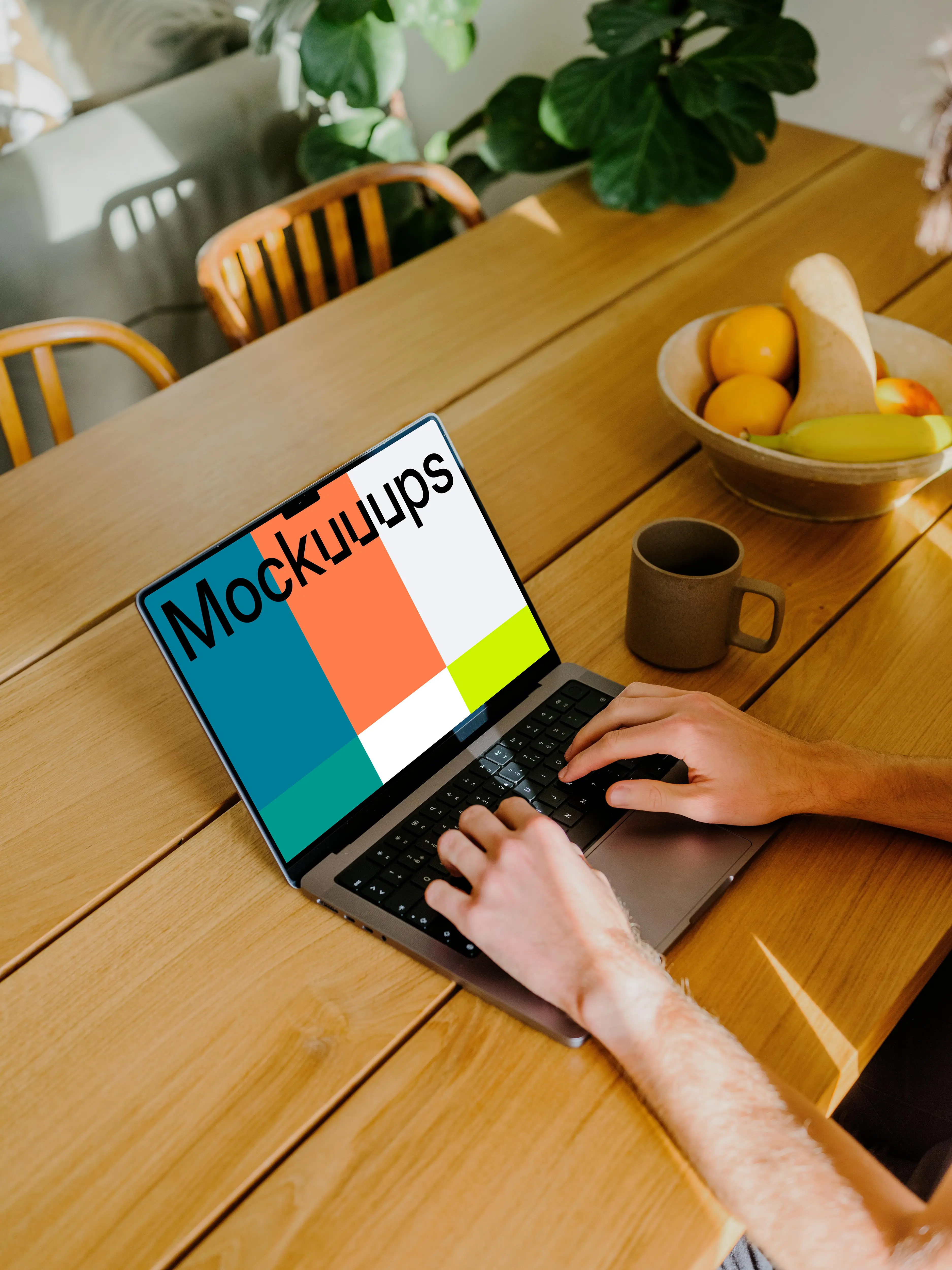 MacBook Pro mockup with a user typing on it.