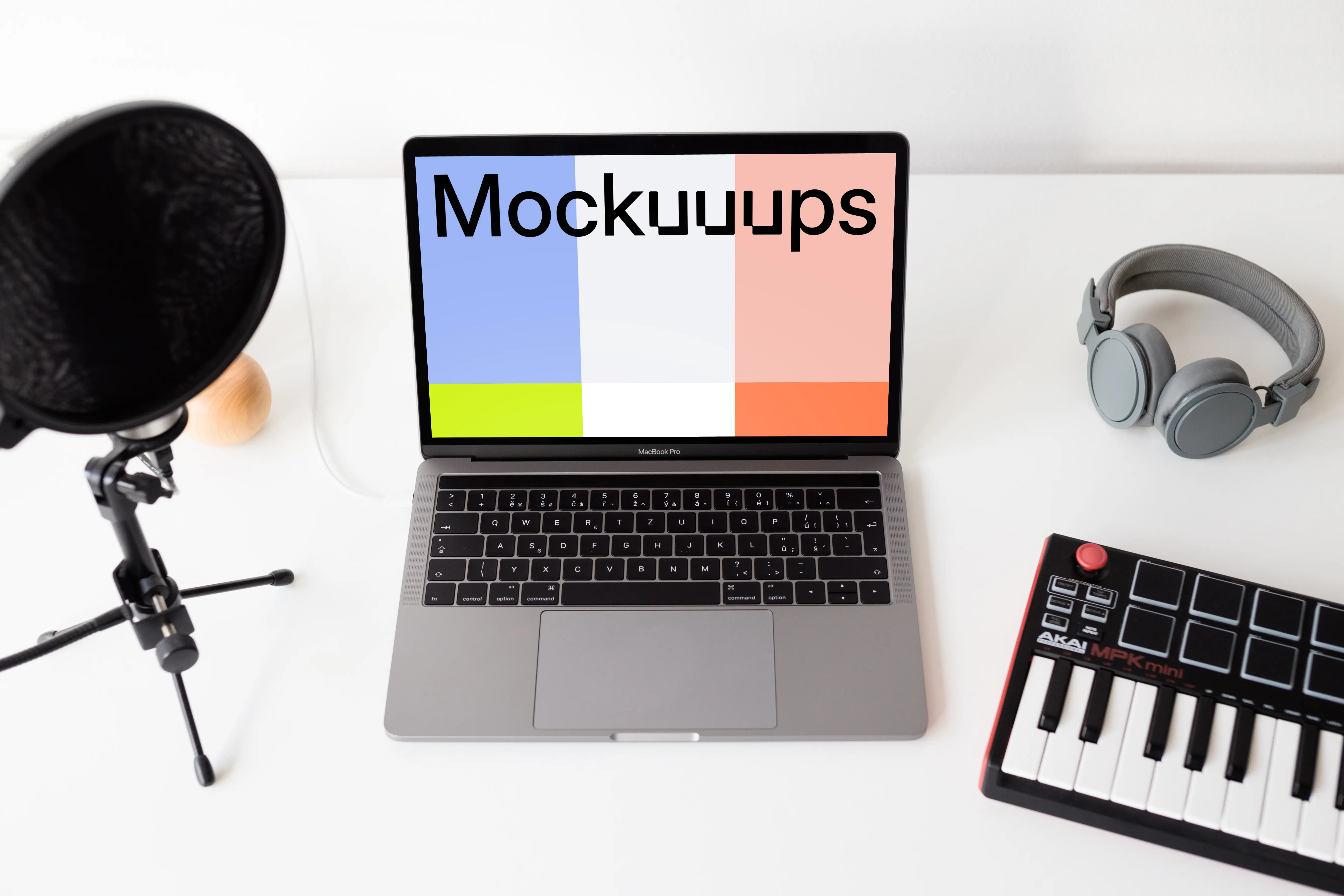Macbook Pro mockup with touchbar and music equipment