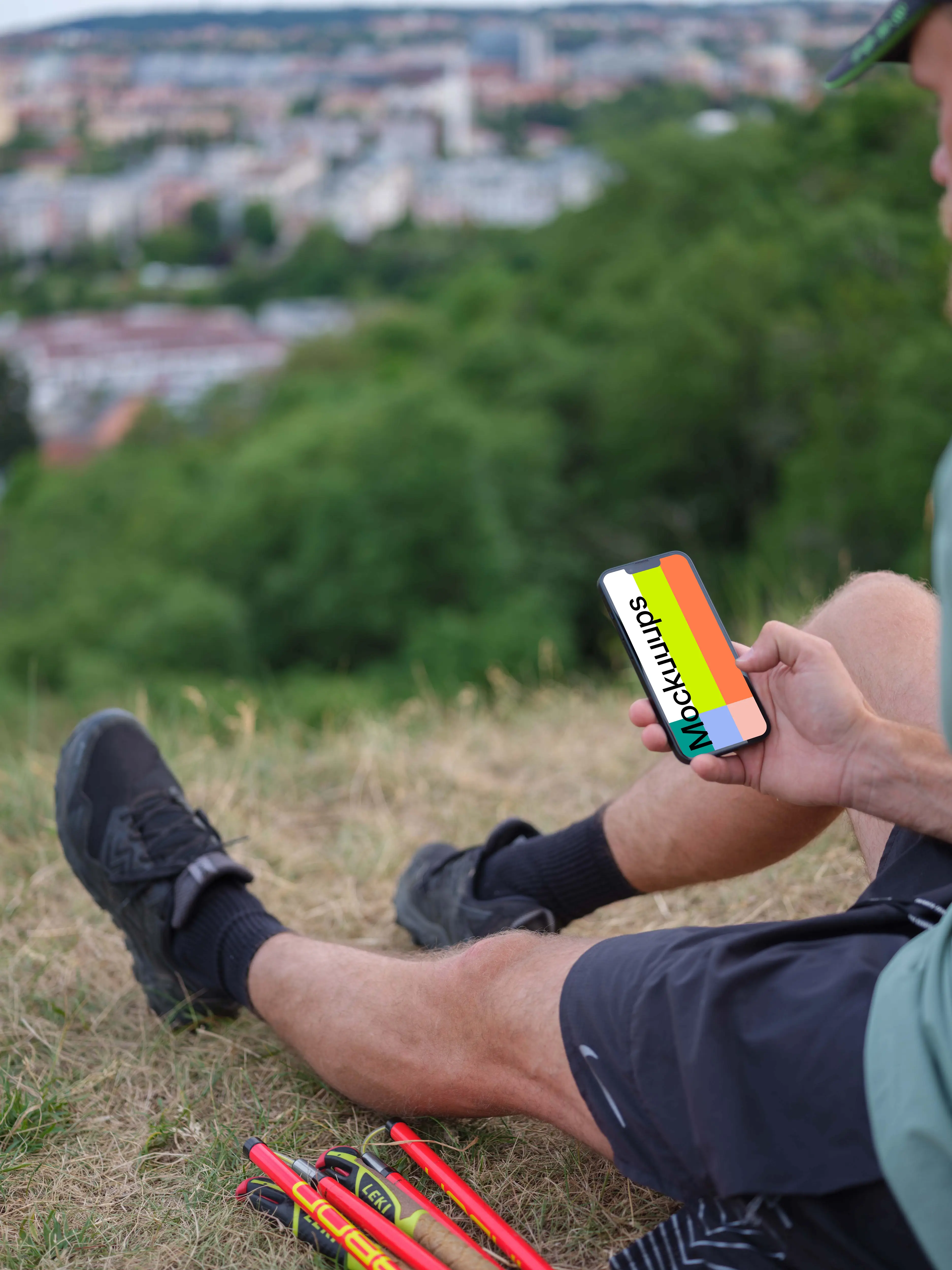 Male hand typing on an iPhone mockup