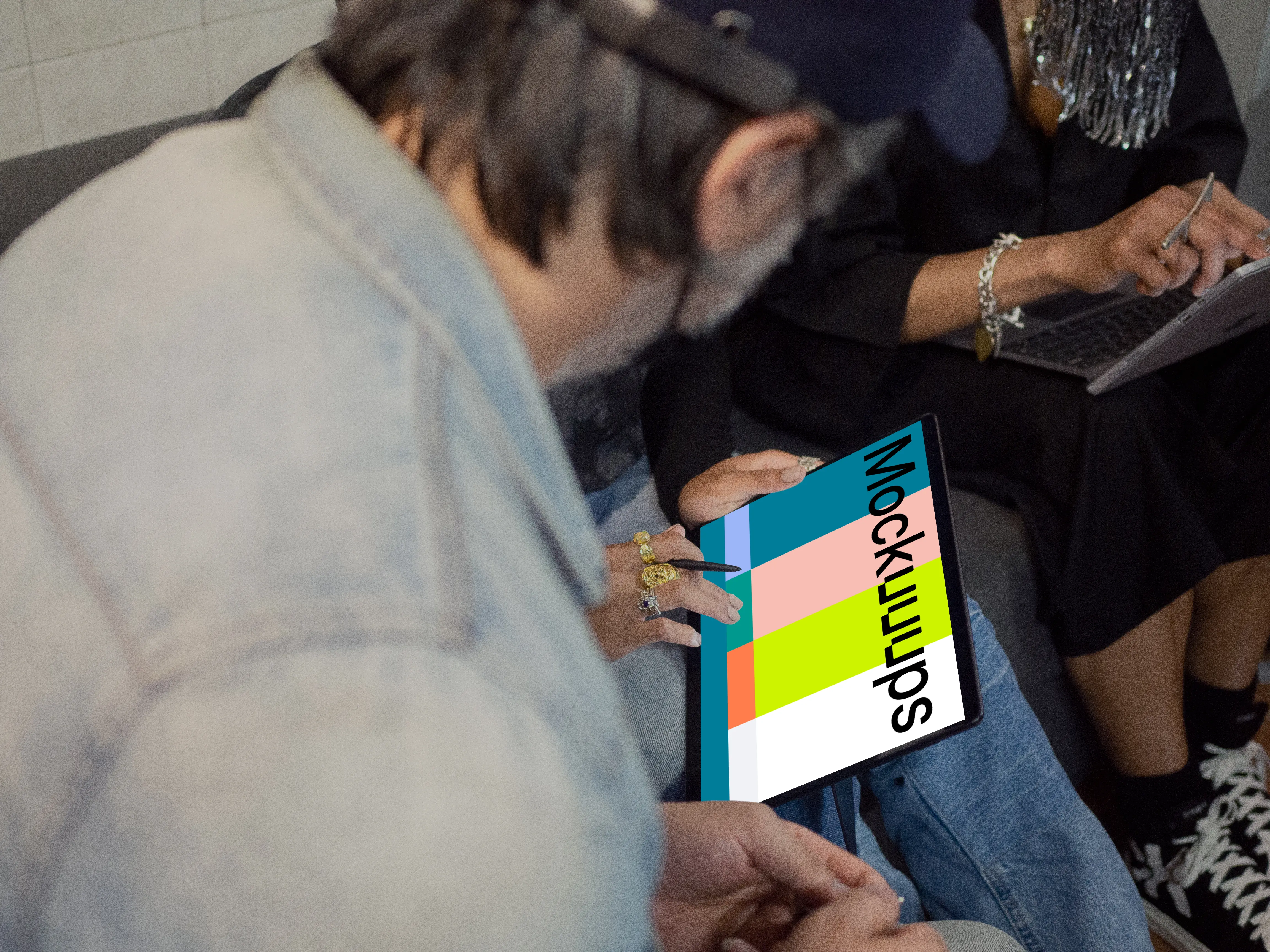 Microsoft Surface laptop mockup being used by two co-workers