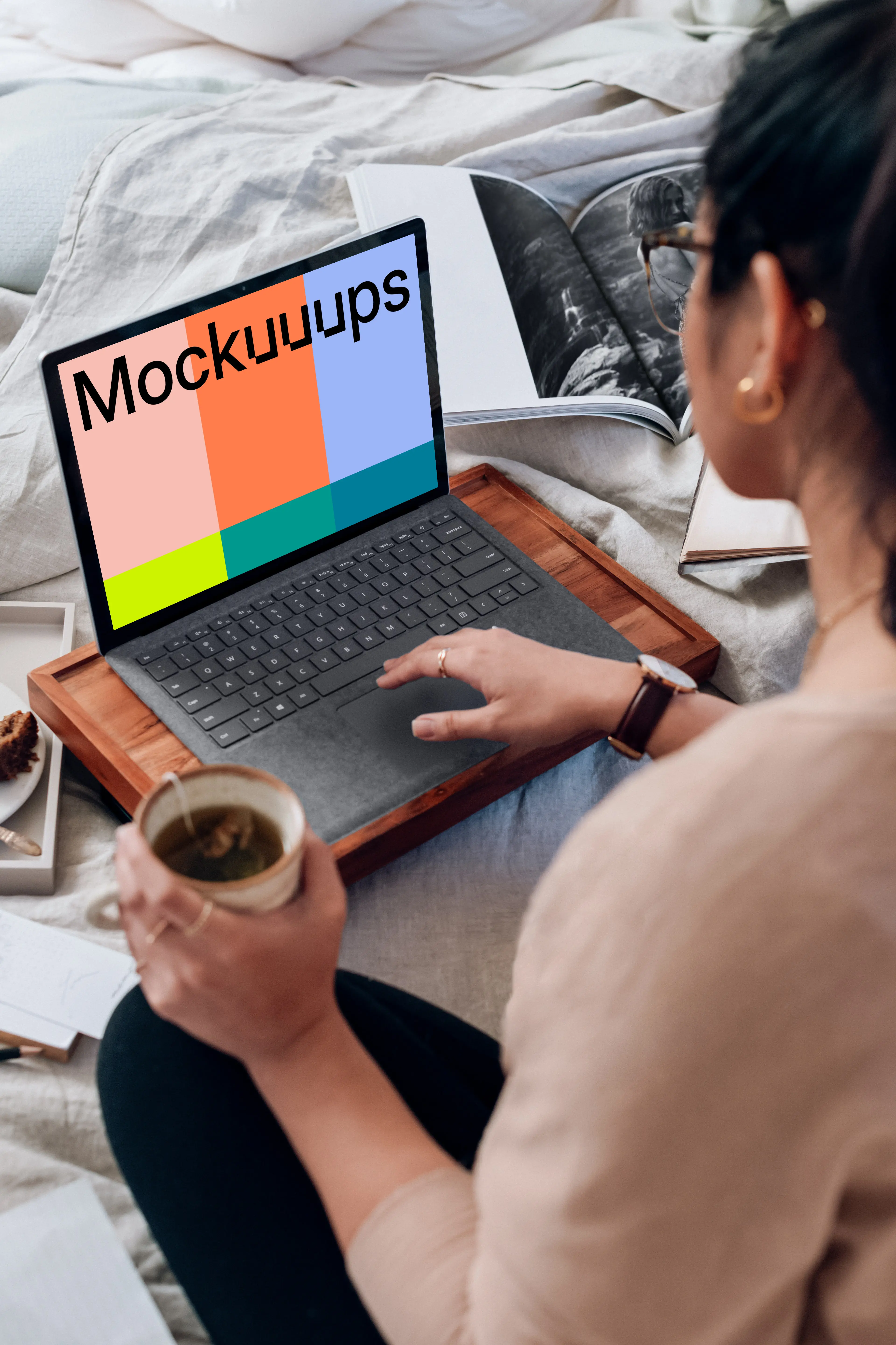 Microsoft Surface Laptop mockup used by a lady on a wooden slab