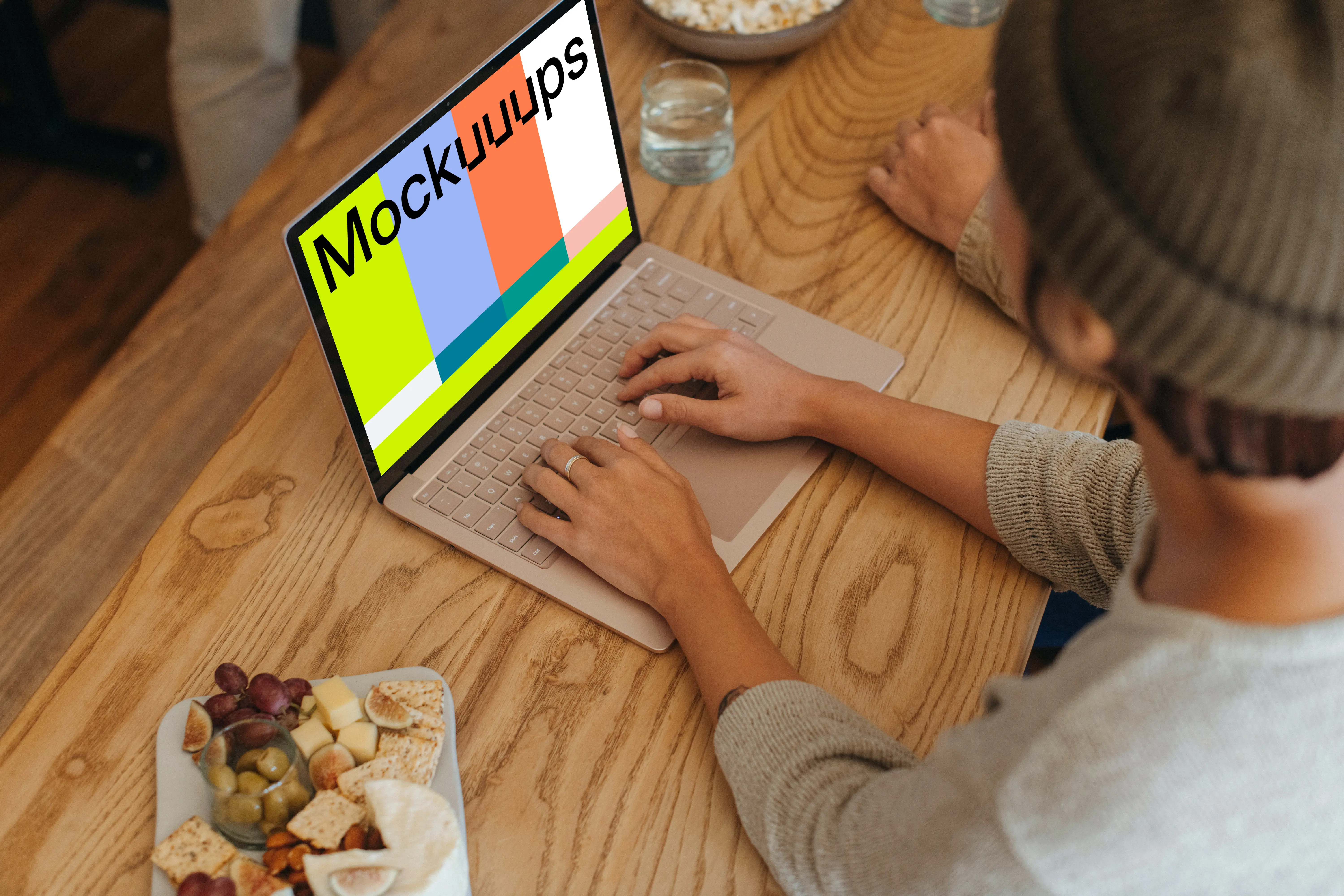 Microsoft Surface Laptop mockup with a platter of food at the side